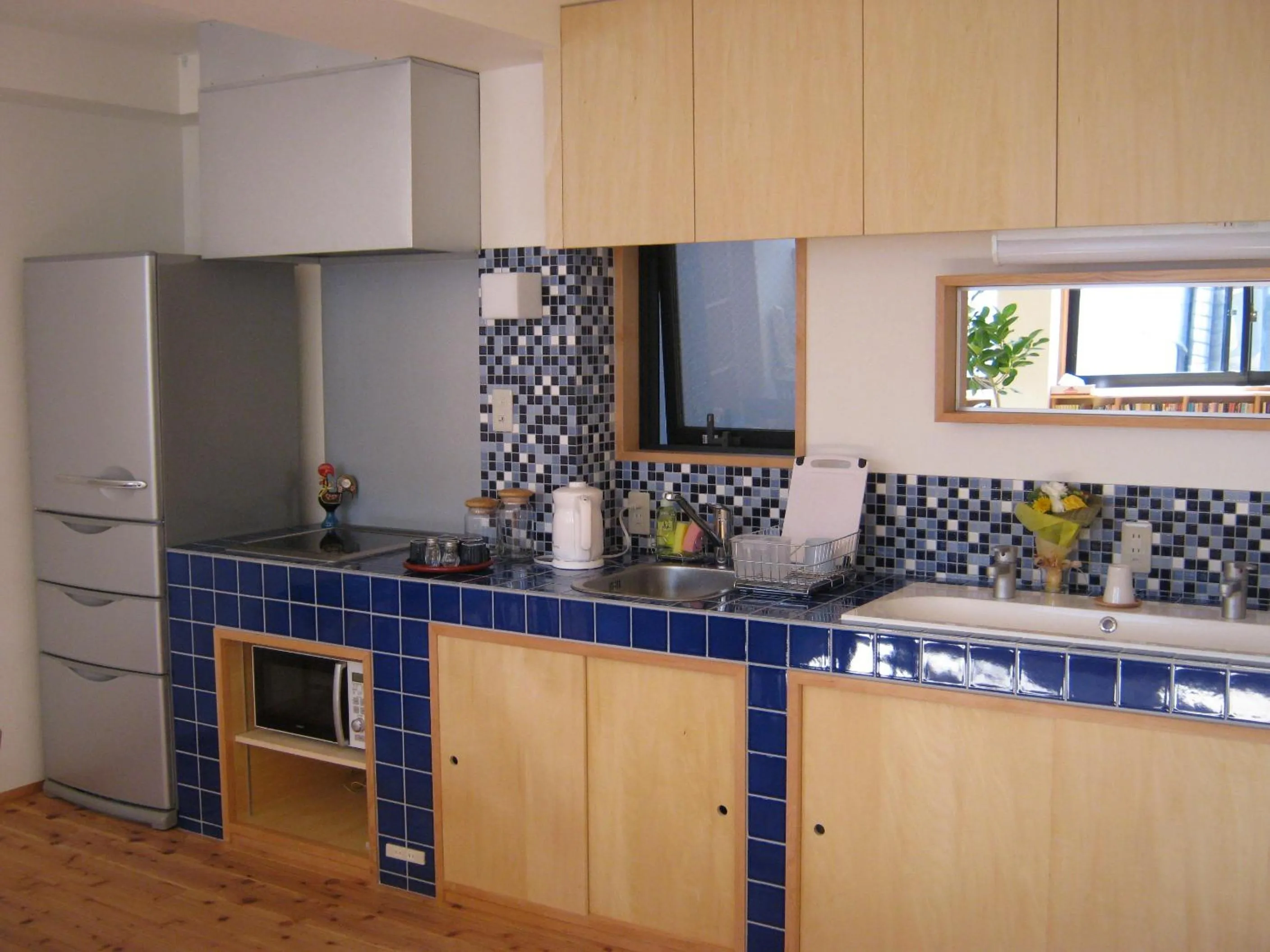 Communal kitchen in Guesthouse Hyakumanben Cross