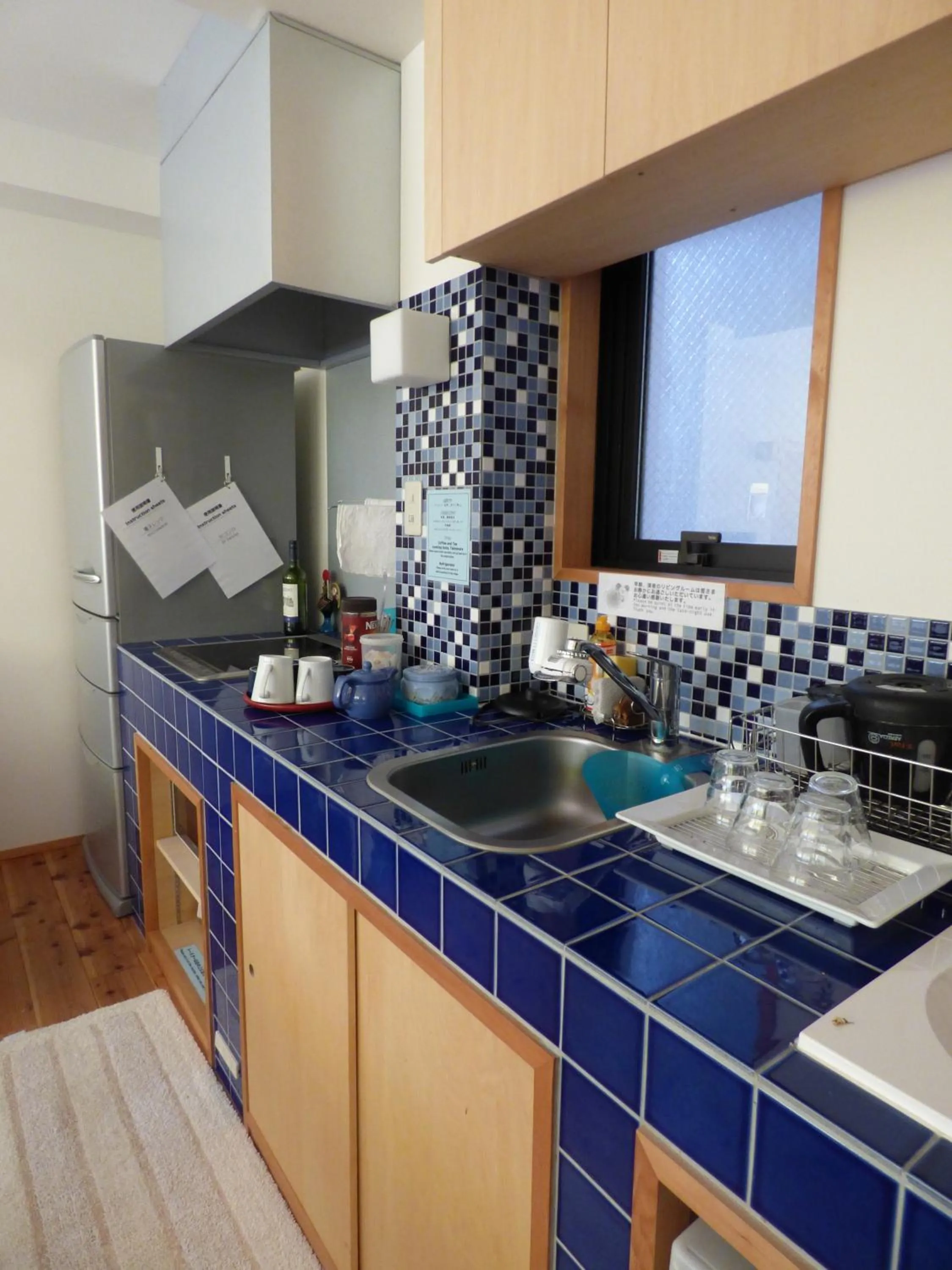 Communal lounge/ TV room in Guesthouse Hyakumanben Cross