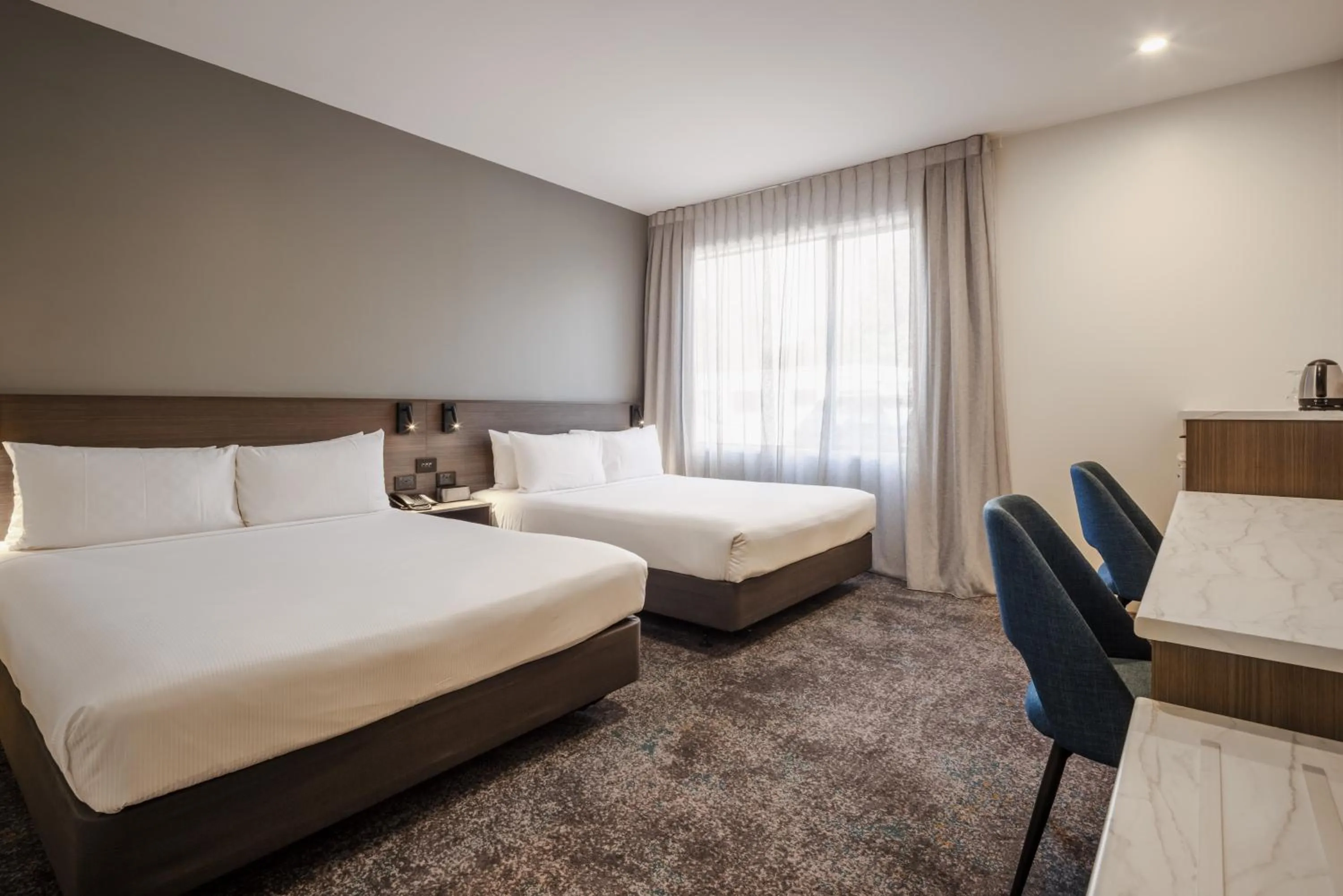 Bed in Heartland Hotel Auckland Airport