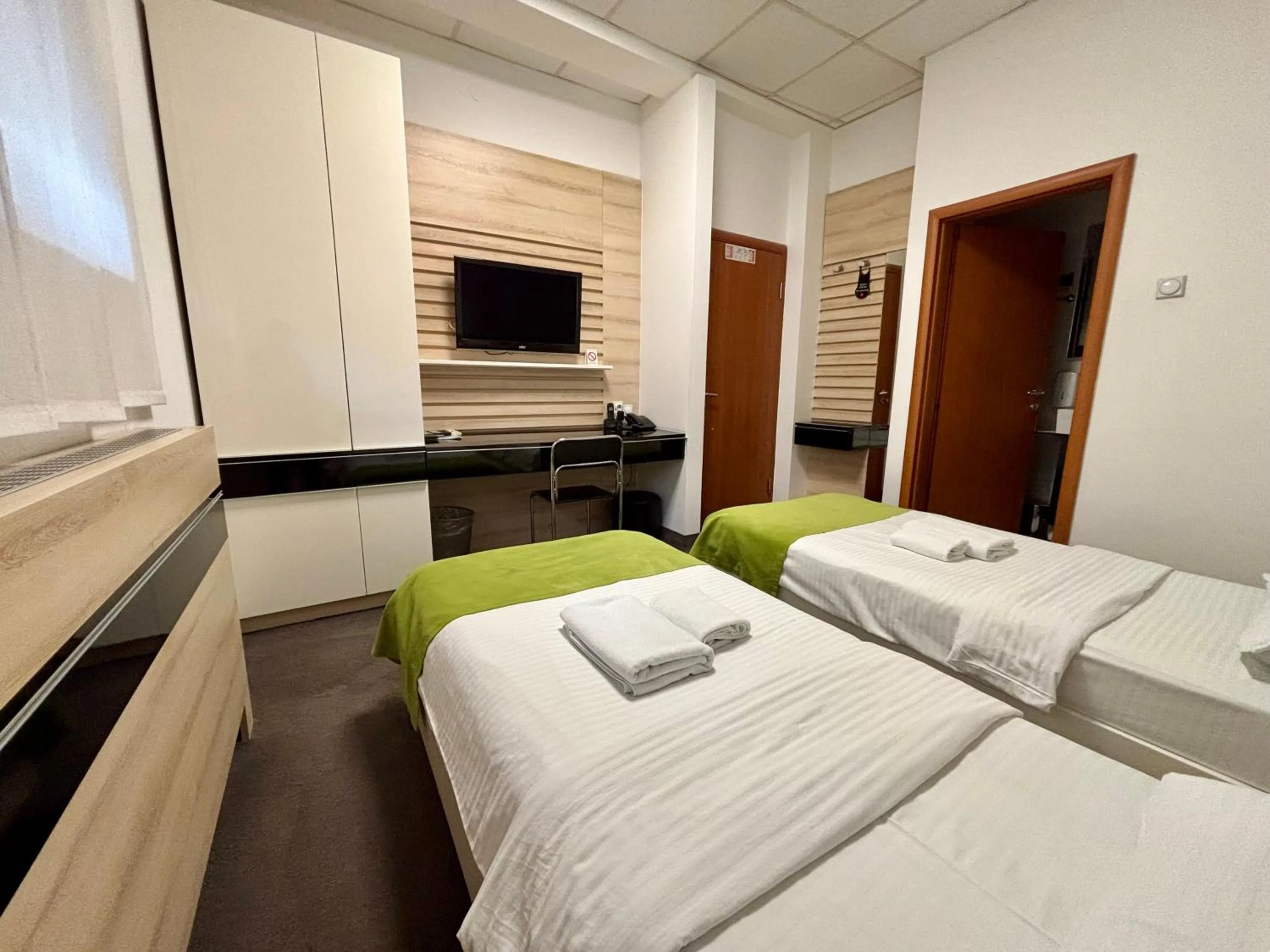 Bed in Garni Hotel Consul