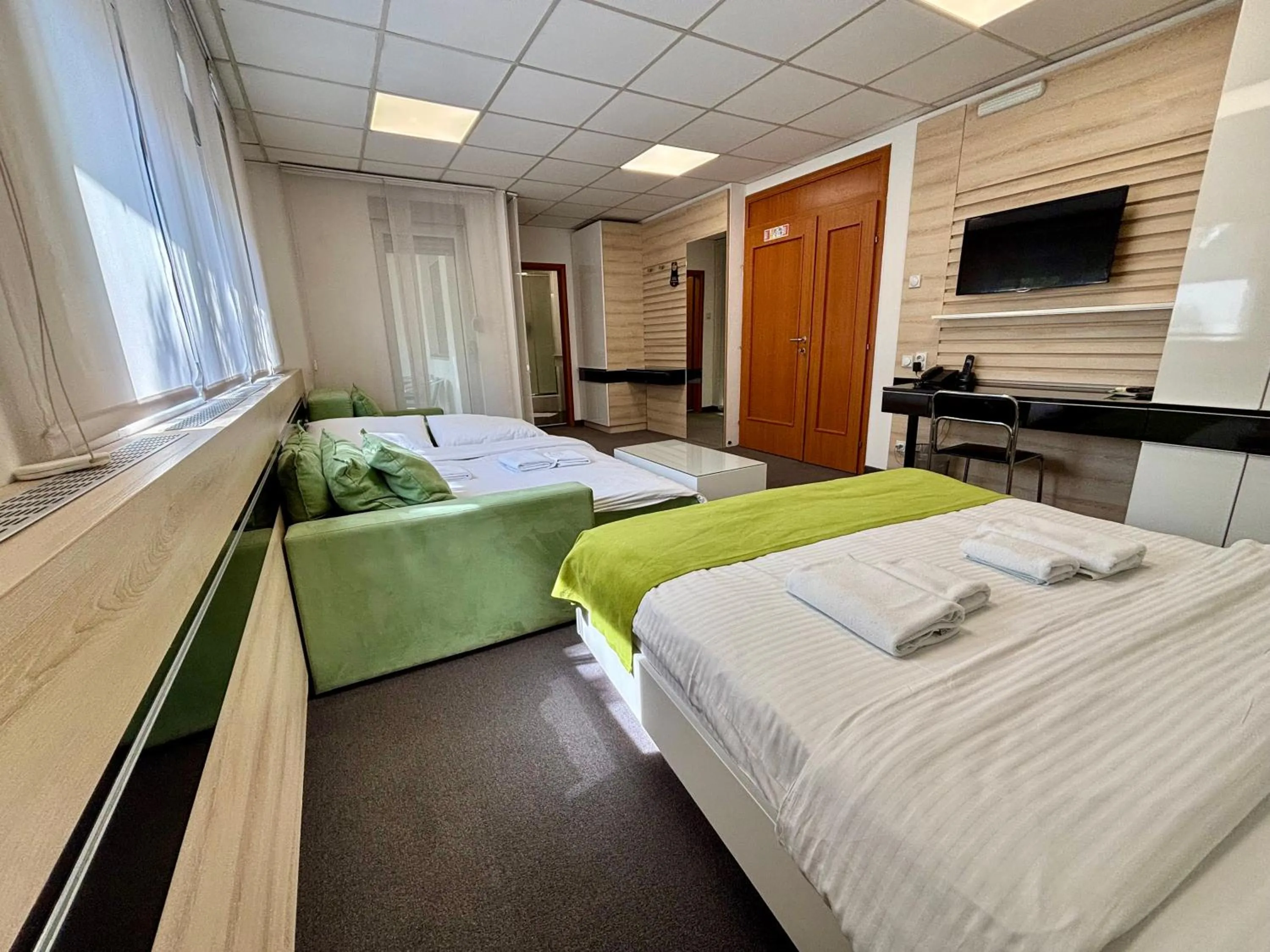 Bed in Garni Hotel Consul