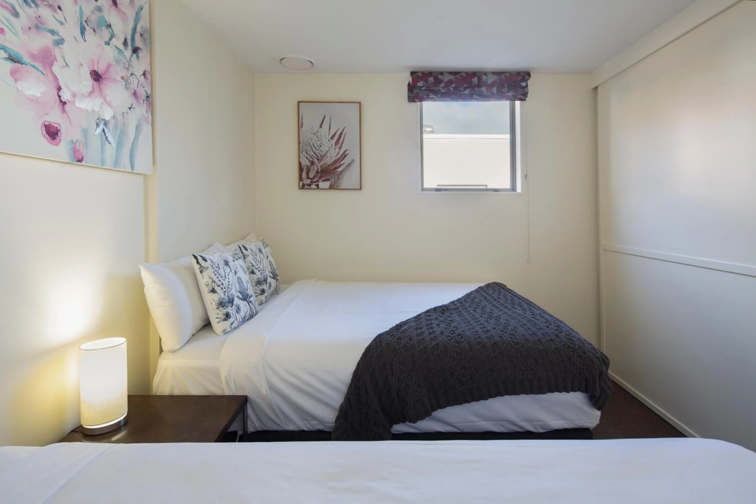 Bed in The Whistler Holiday Apartments