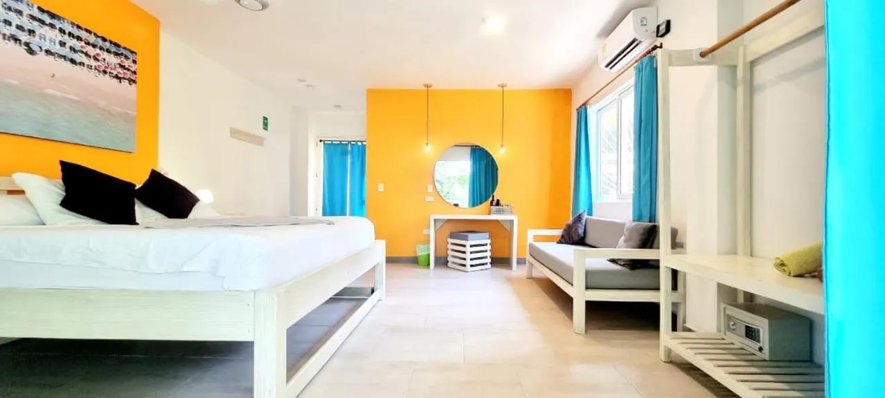 Bed in Blue Mango Beach Hotel