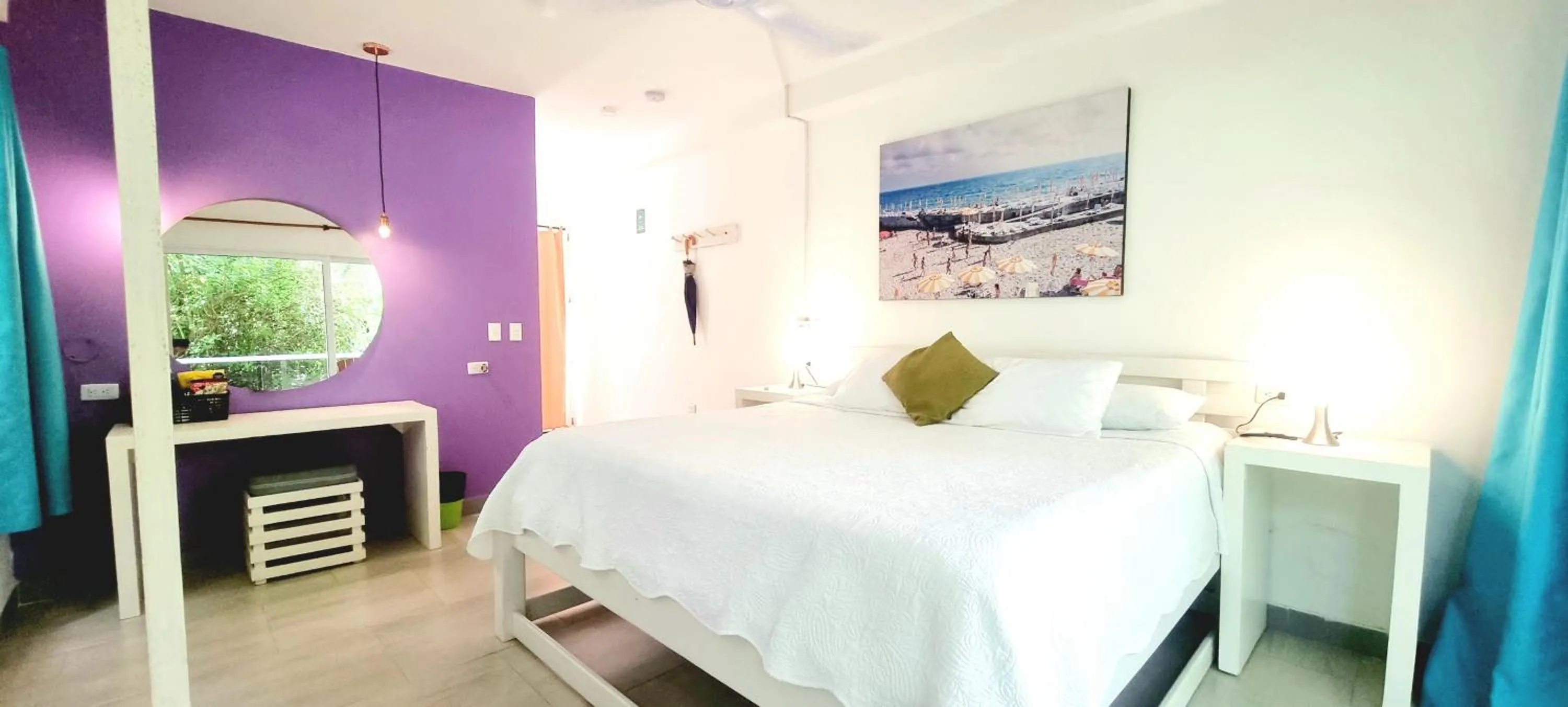 Bed in Blue Mango Beach Hotel