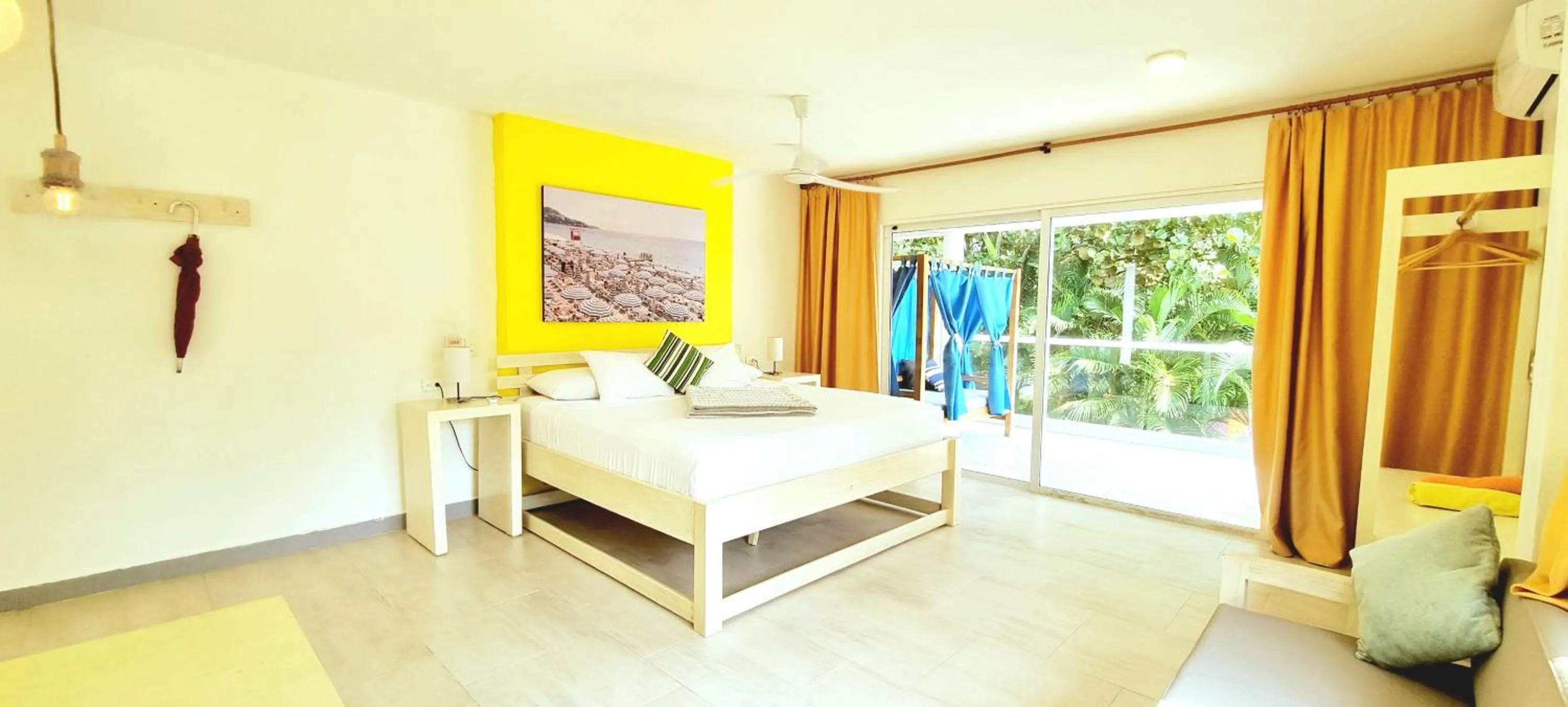 Bed in Blue Mango Beach Hotel