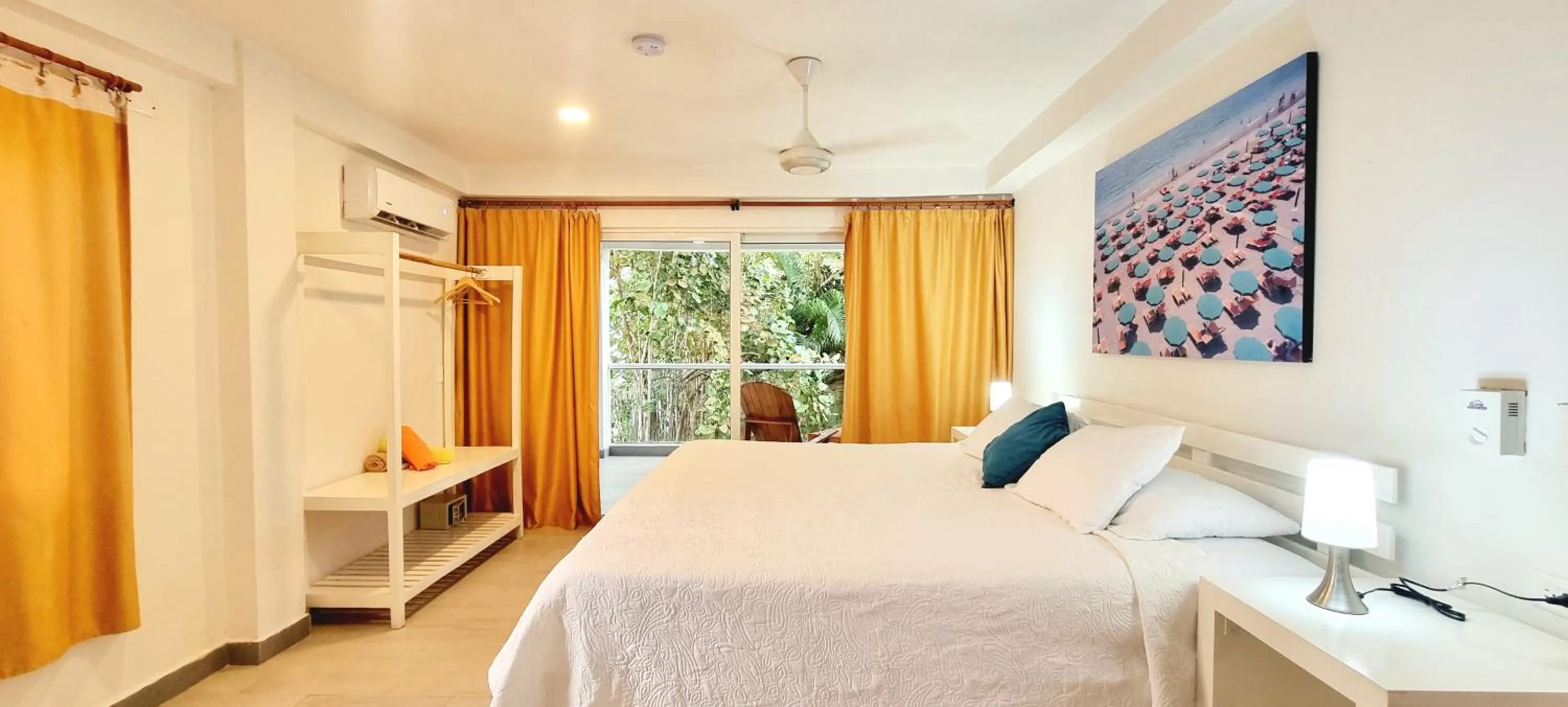 Bed in Blue Mango Beach Hotel