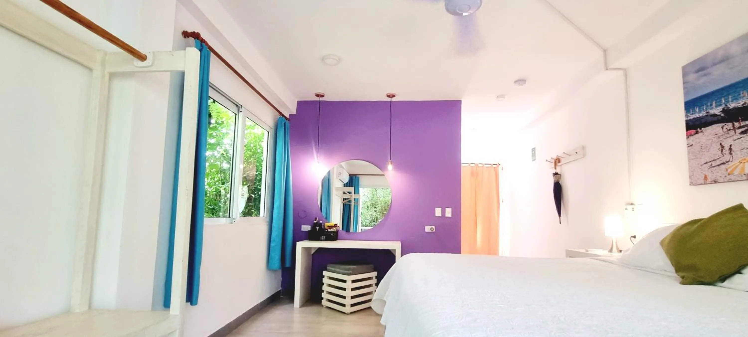 Bed in Blue Mango Beach Hotel