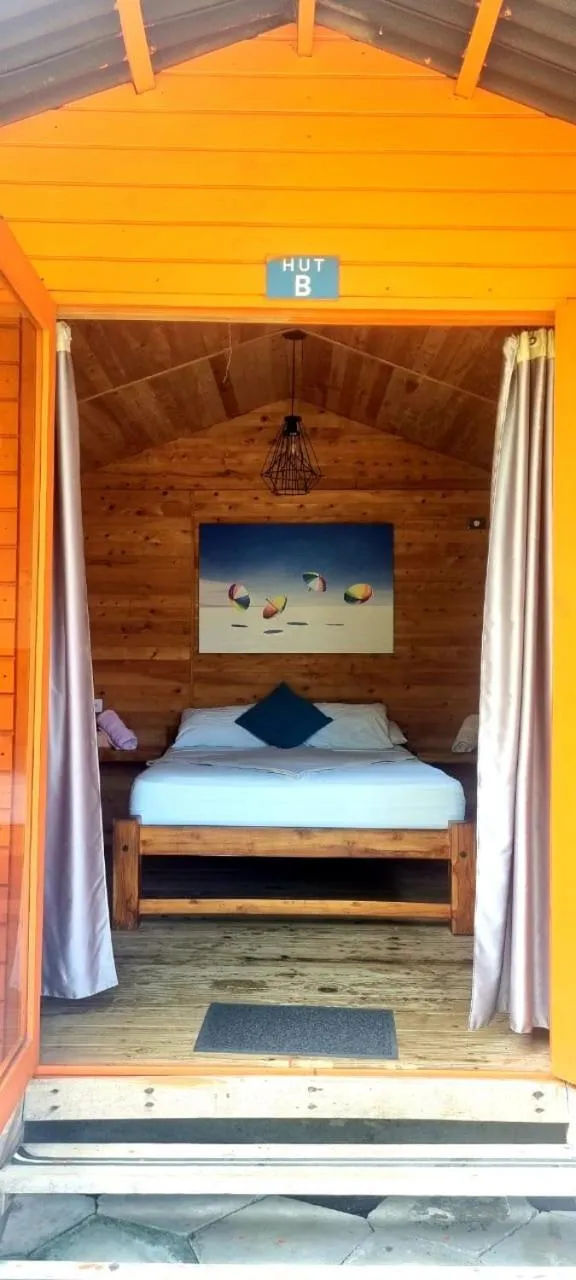 Bed in Blue Mango Beach Hotel