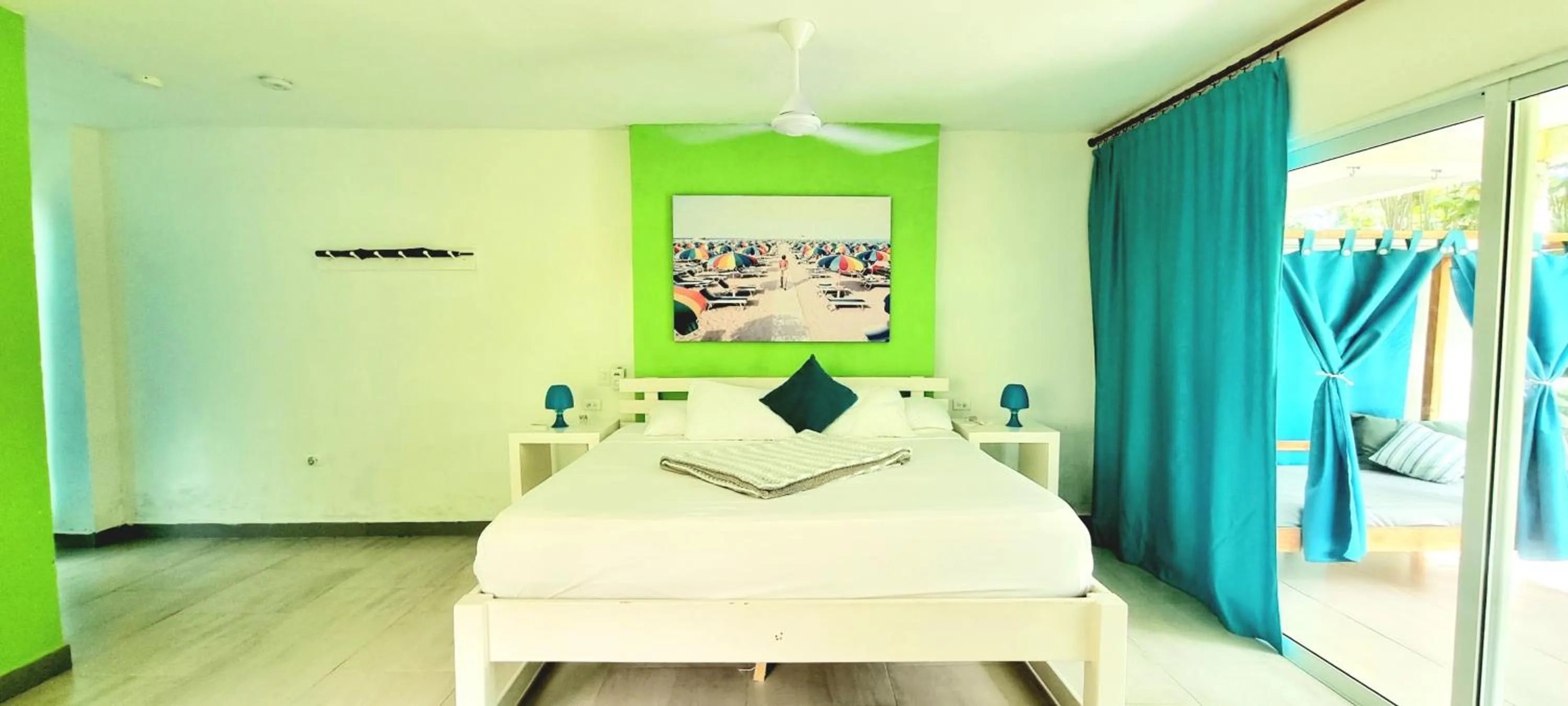 Bed in Blue Mango Beach Hotel