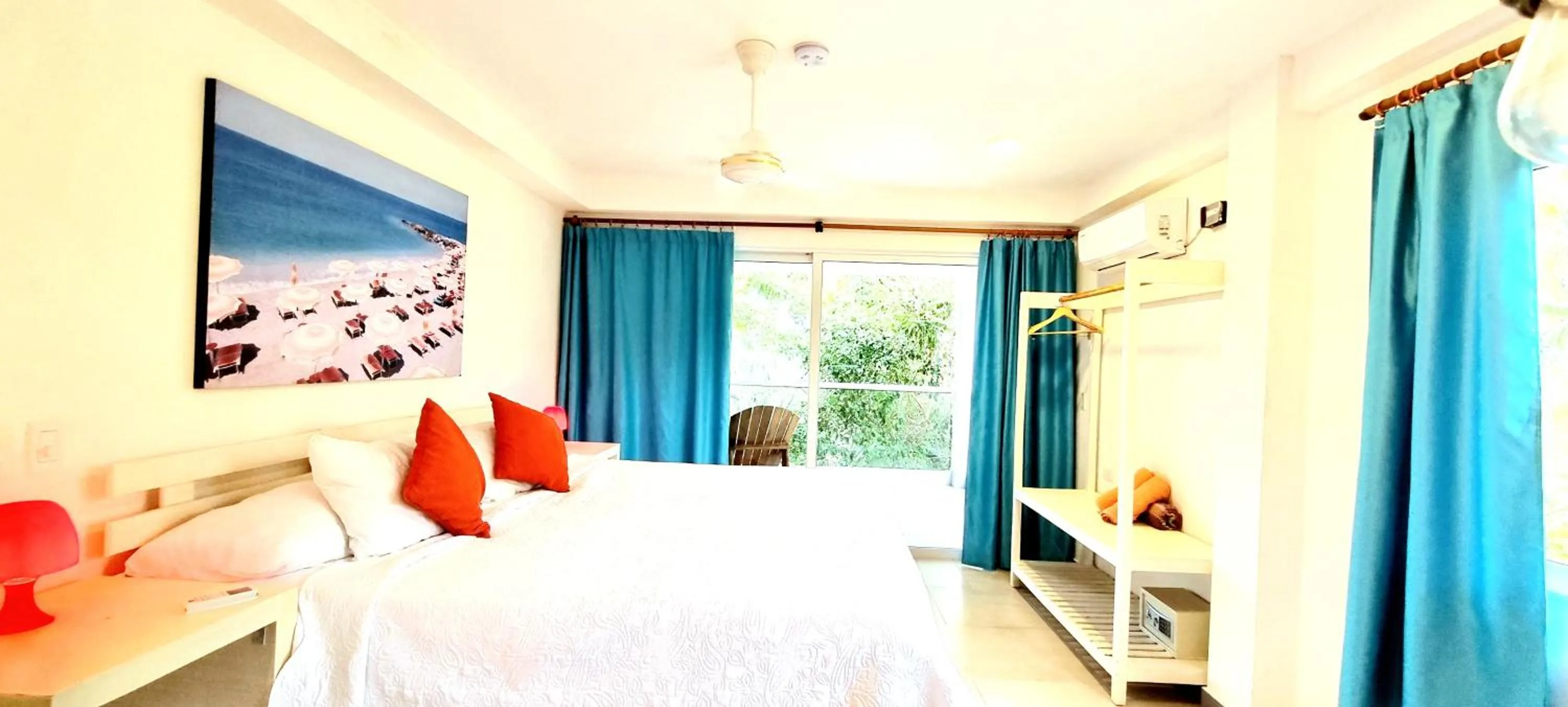 Bed in Blue Mango Beach Hotel