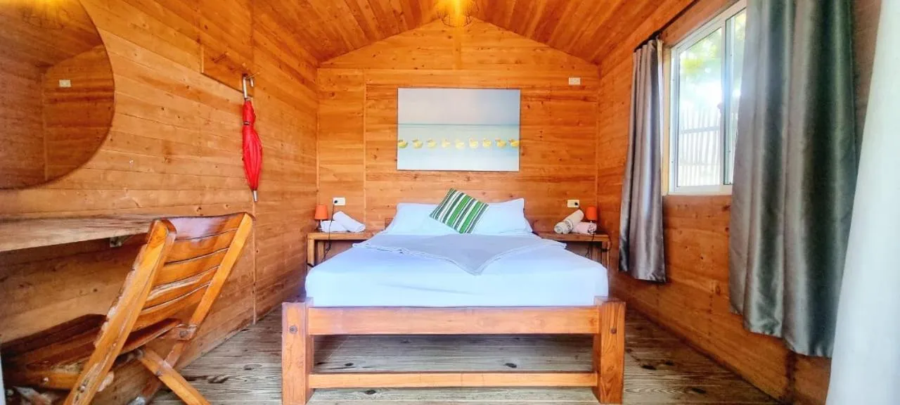 Bed in Blue Mango Beach Hotel