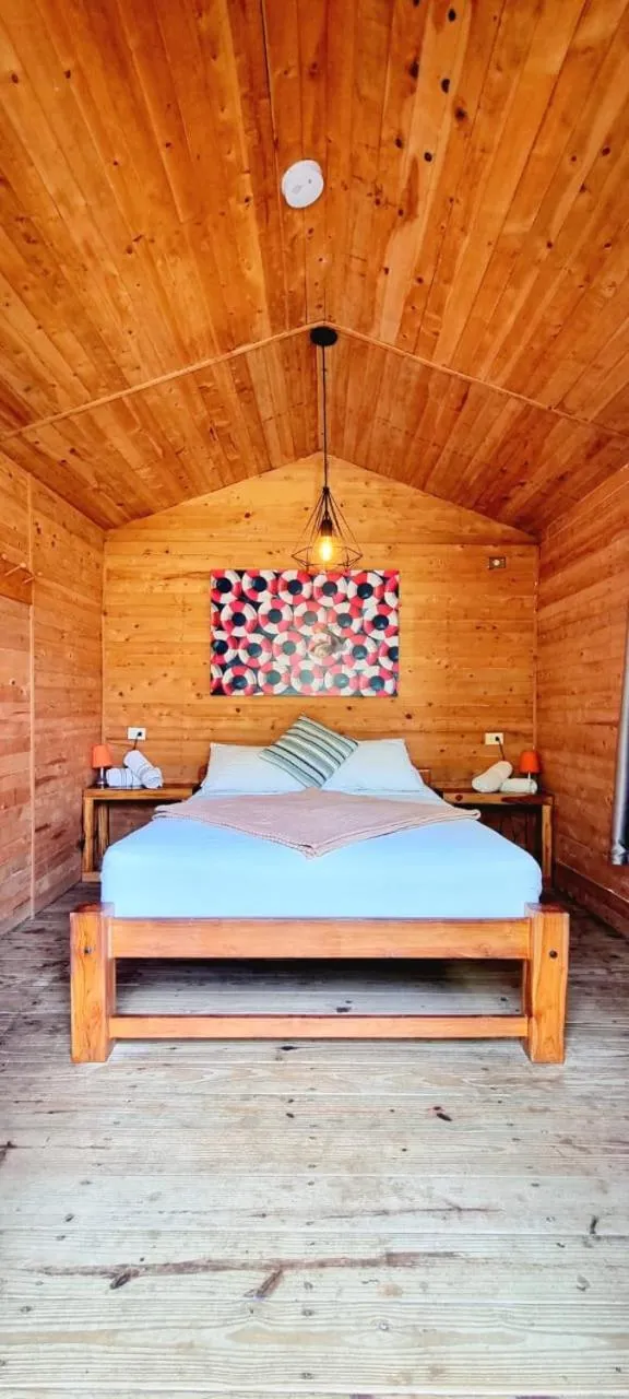 Bed in Blue Mango Beach Hotel