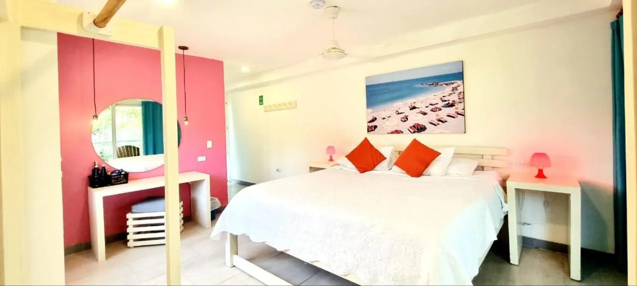 Bed in Blue Mango Beach Hotel