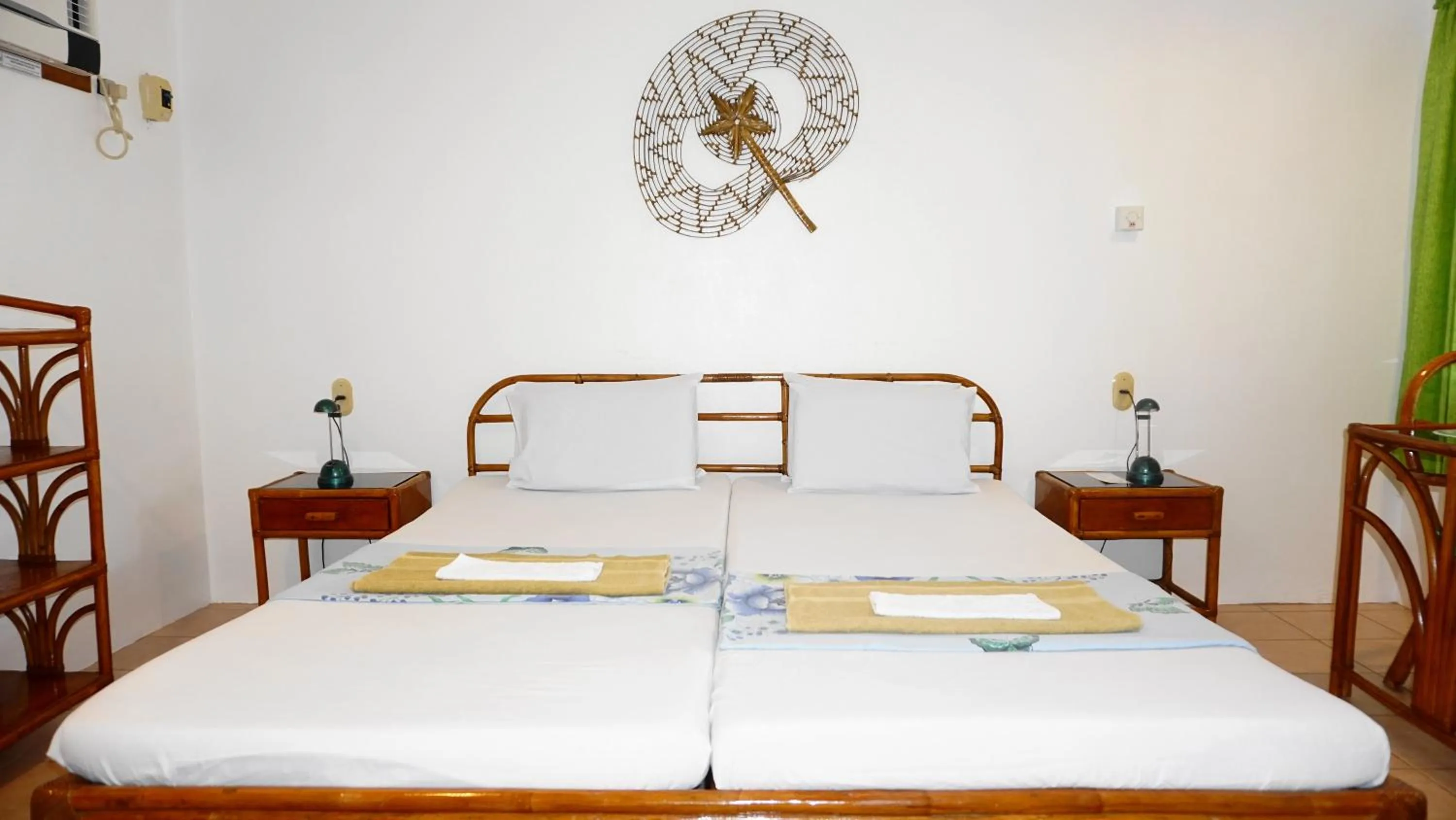Bed in Marcosas Cottages Resort