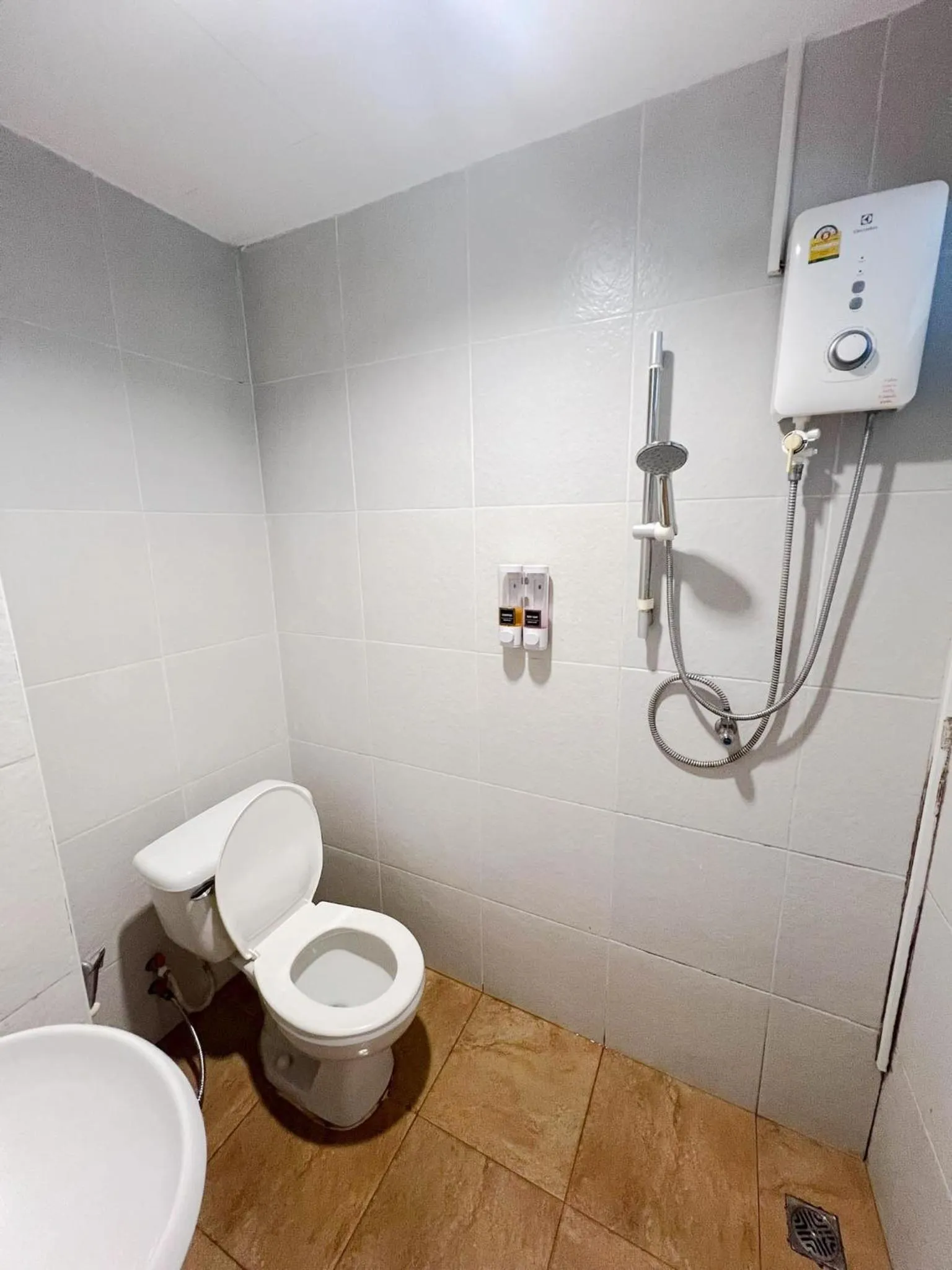 Toilet in Inspire House Hotel