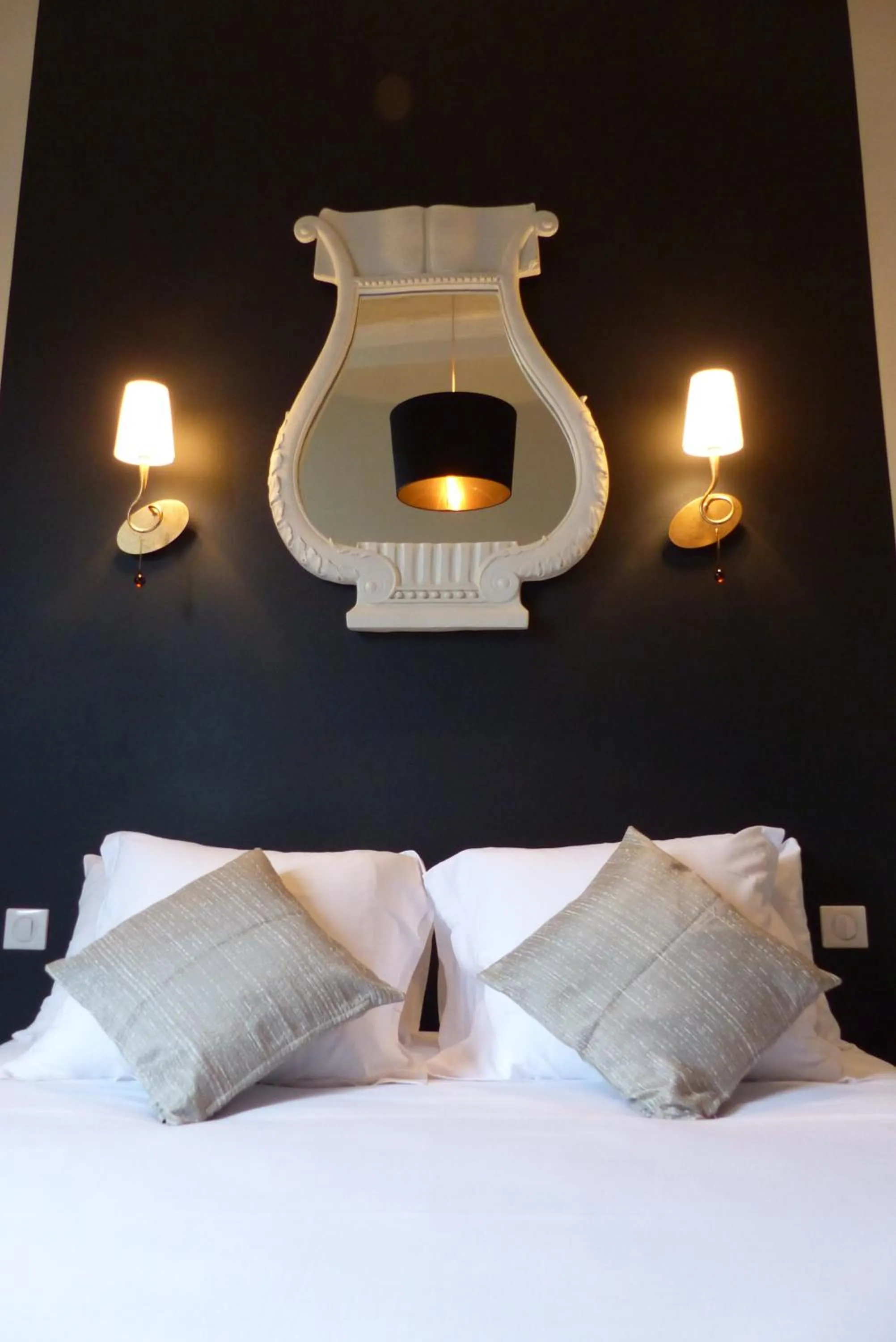Decorative detail, Bed in Logis Hotel Restaurant Le Cheval Blanc