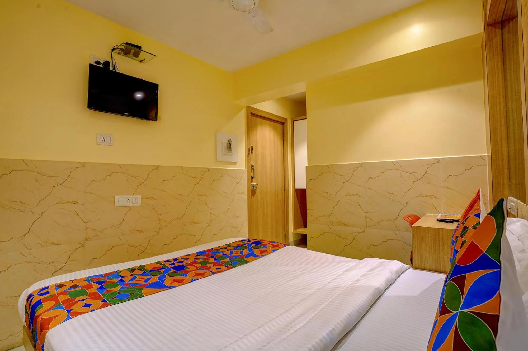 Bed in FabHotel Starwood Residency - 100M From Dr DY Patil Stadium