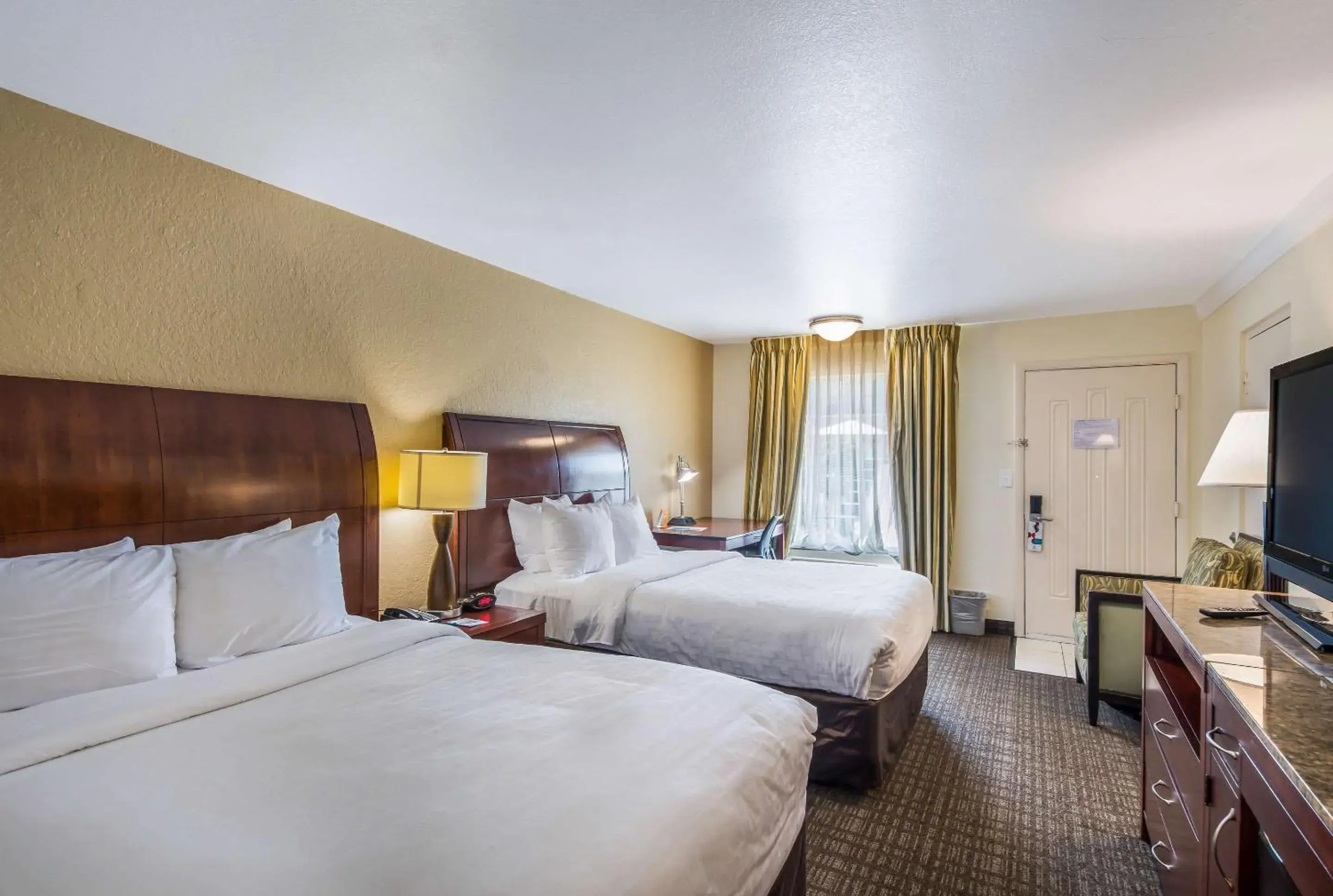 Photo of the whole room, Bed in Clarion Inn & Suites Central Clearwater Beach Photo of the whole room, Bed in Clarion Inn & Suites Central Clearwater Beach