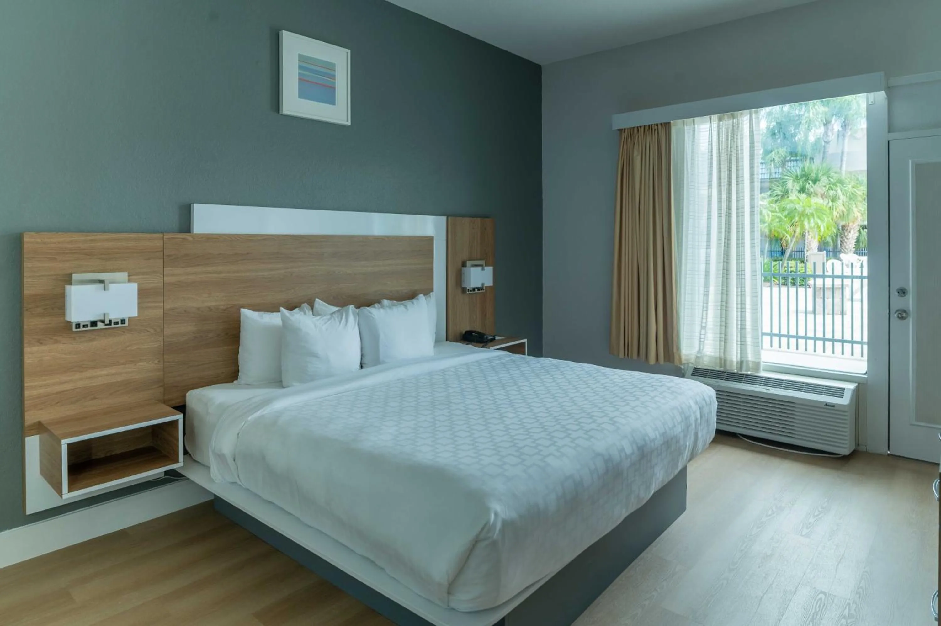 Bed in Clarion Inn & Suites Central Clearwater Beach