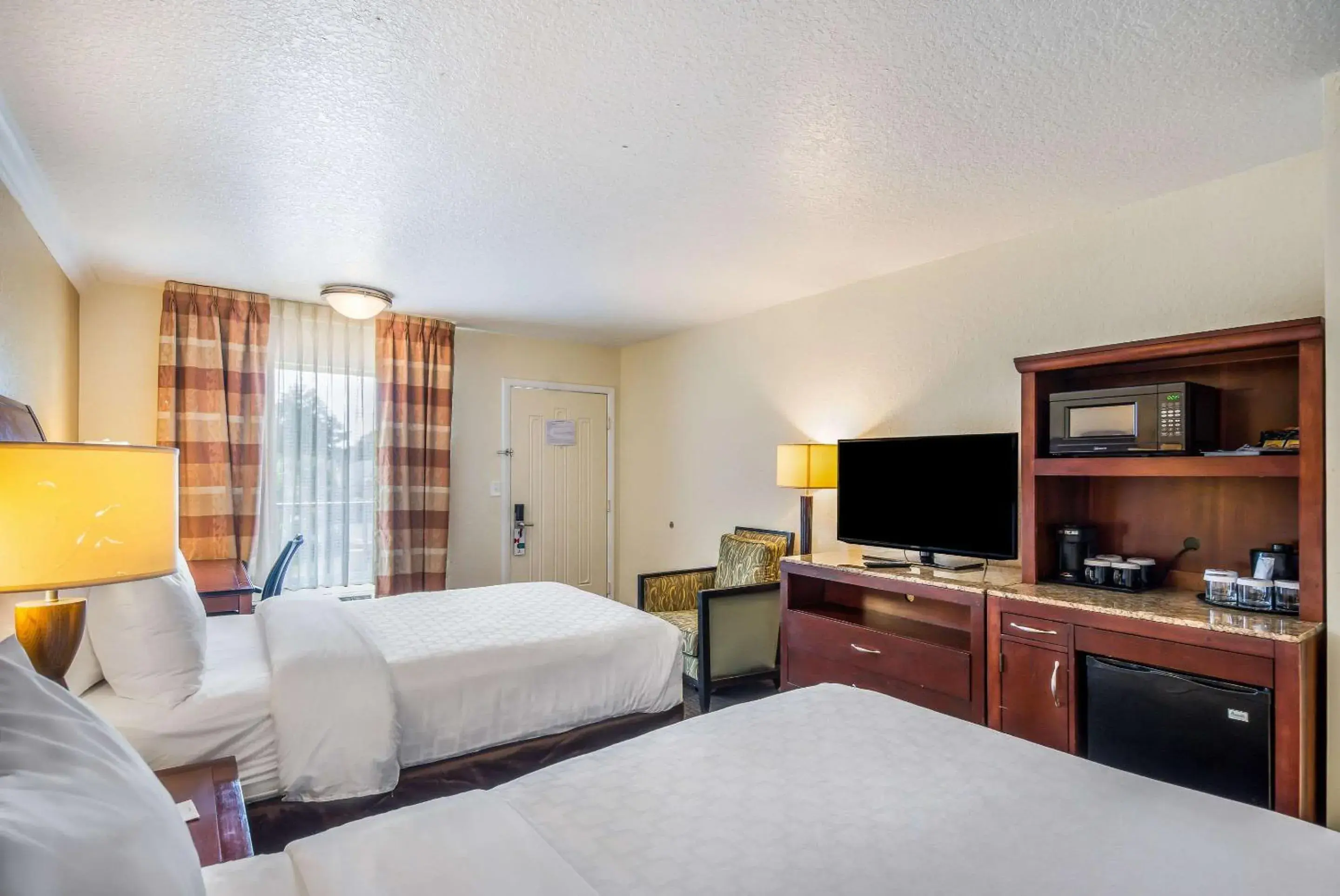 Photo of the whole room, Bed in Clarion Inn & Suites Central Clearwater Beach Photo of the whole room, Bed in Clarion Inn & Suites Central Clearwater Beach