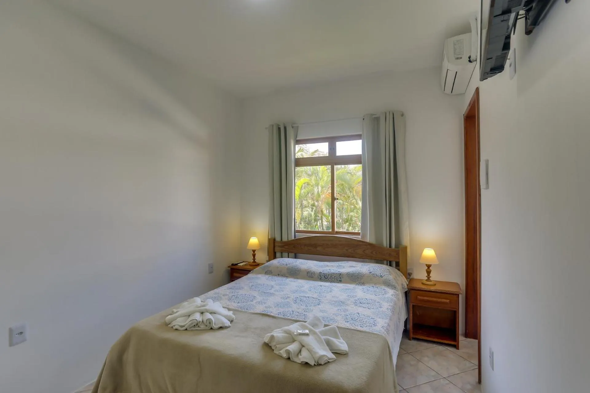 Bed in Pousada Carolina