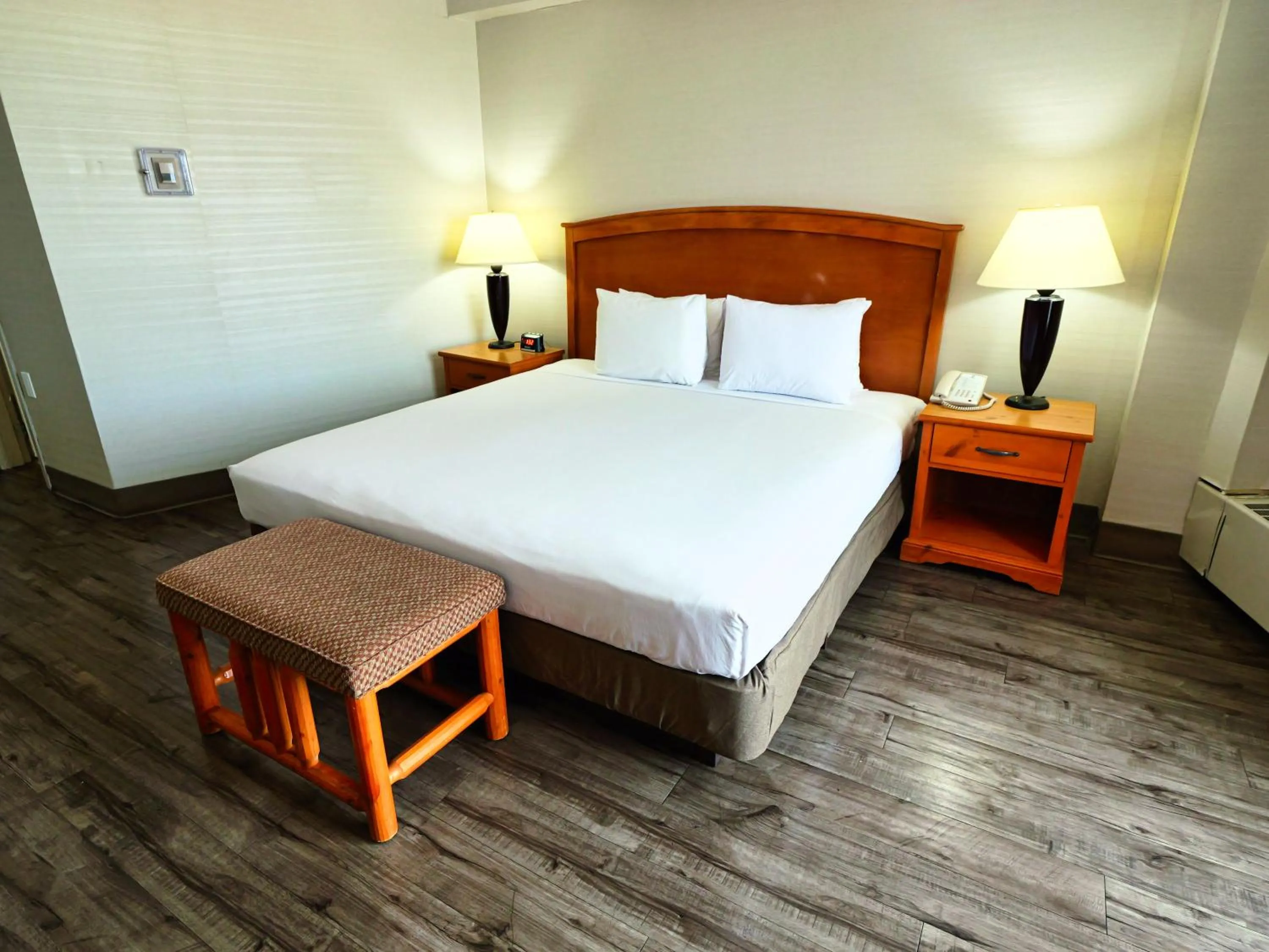 Bed in Continental Inn & Suites