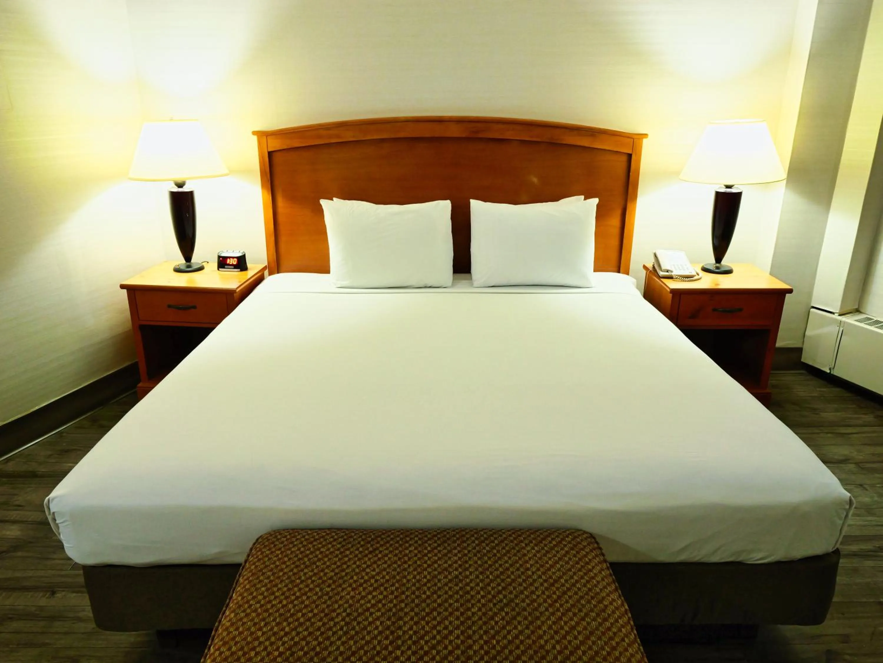 Bed in Continental Inn & Suites