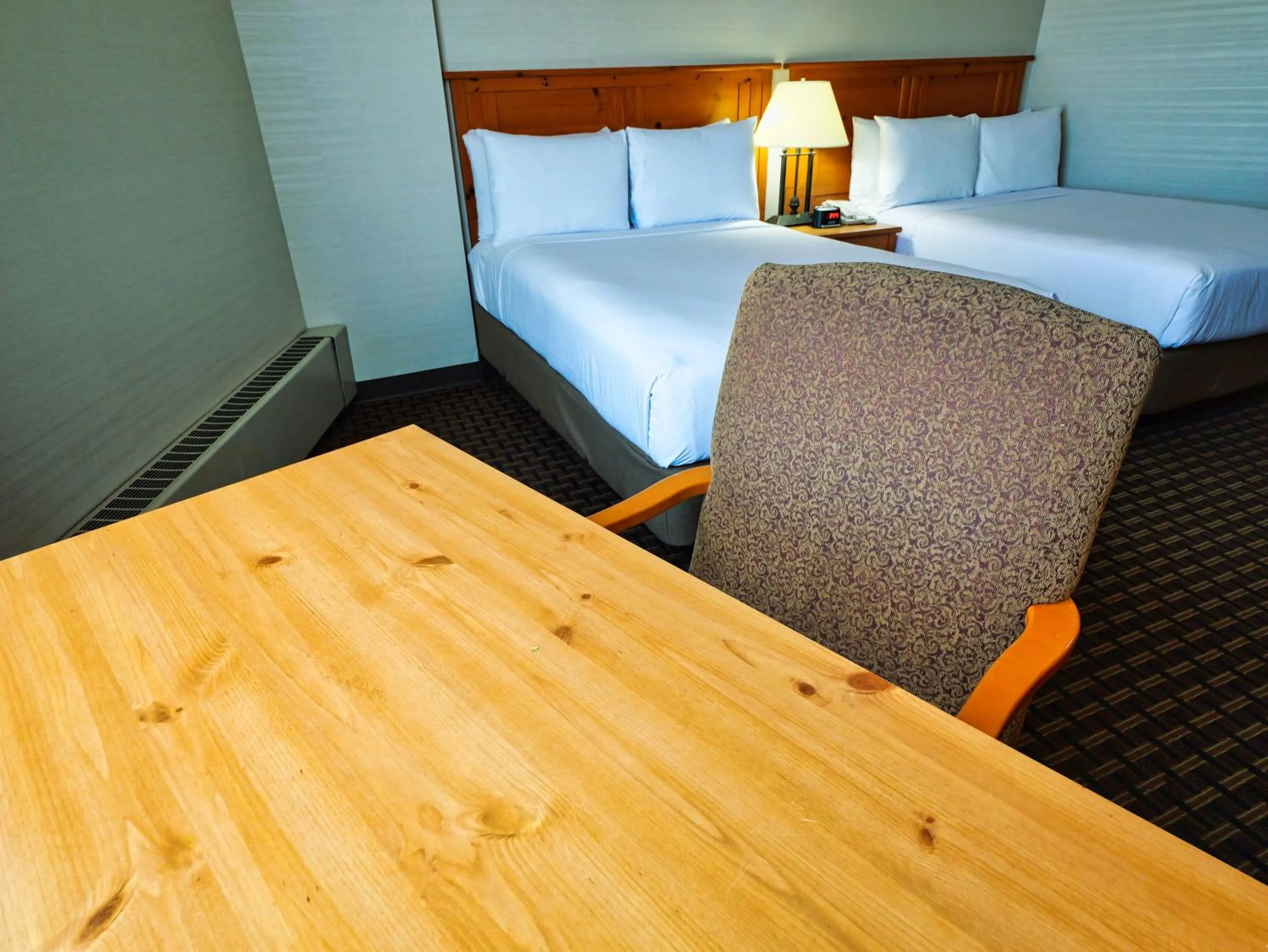 Bed in Continental Inn & Suites