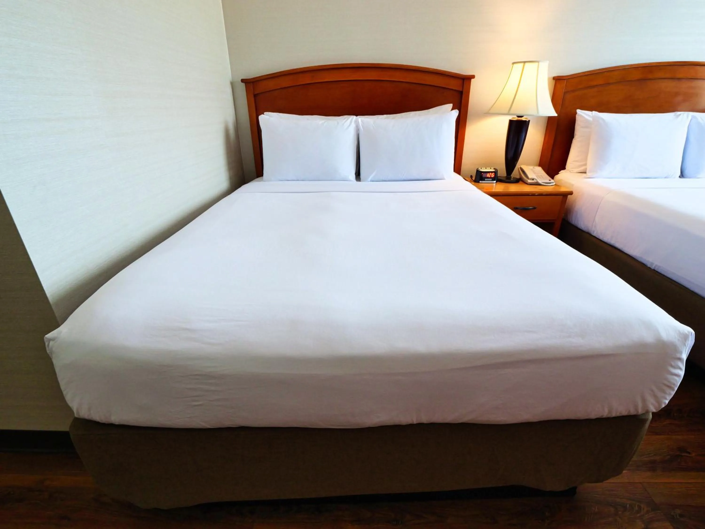 Bed in Continental Inn & Suites