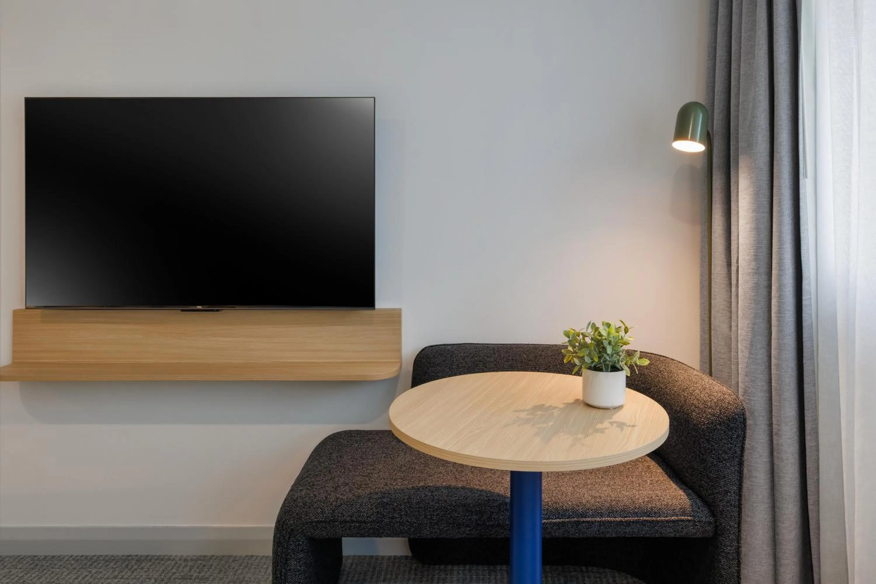 Communal lounge/ TV room in Quest at Sydney Olympic Park