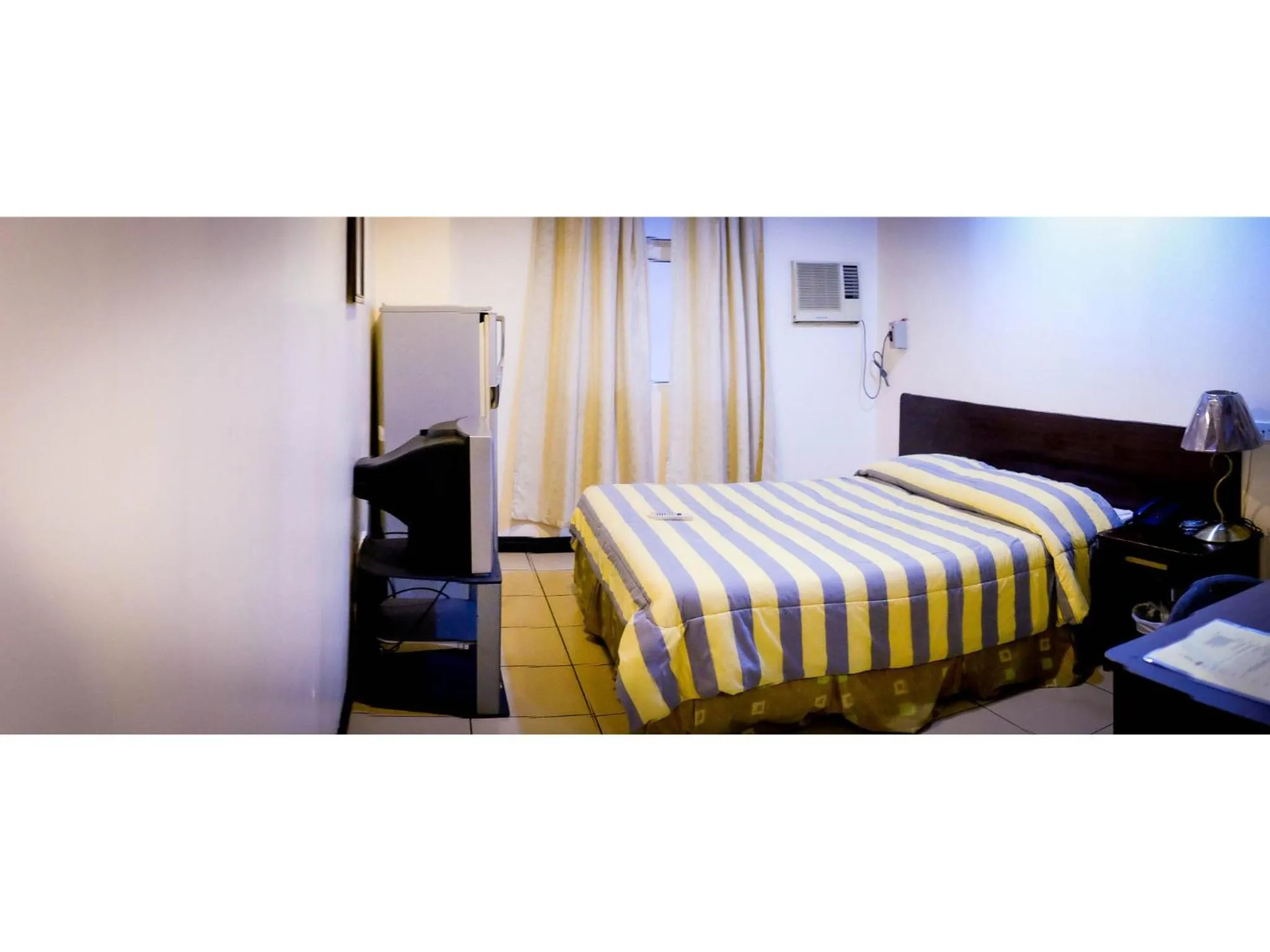 Bed in Crowne Garden Hotel