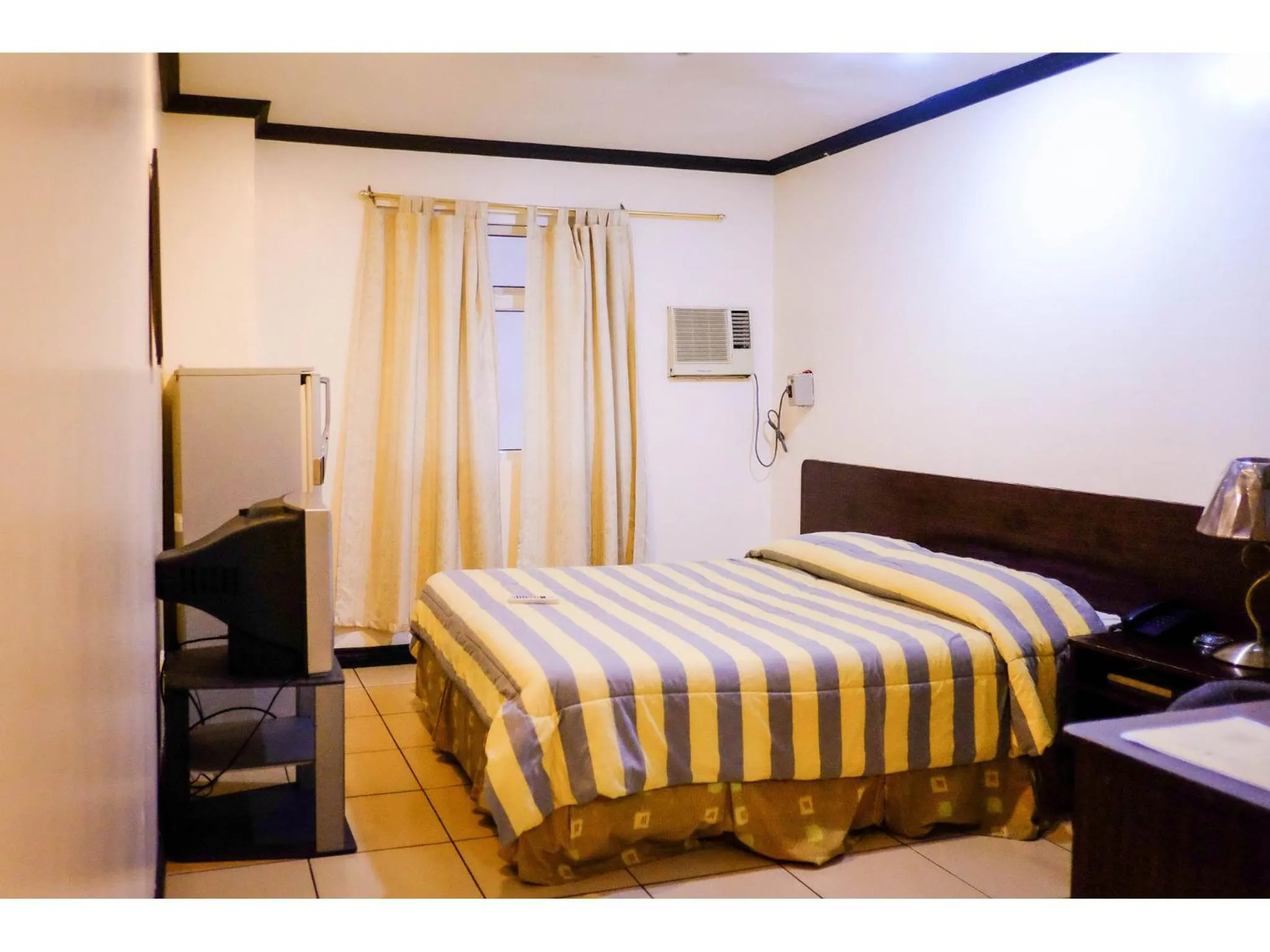 Bed in Crowne Garden Hotel