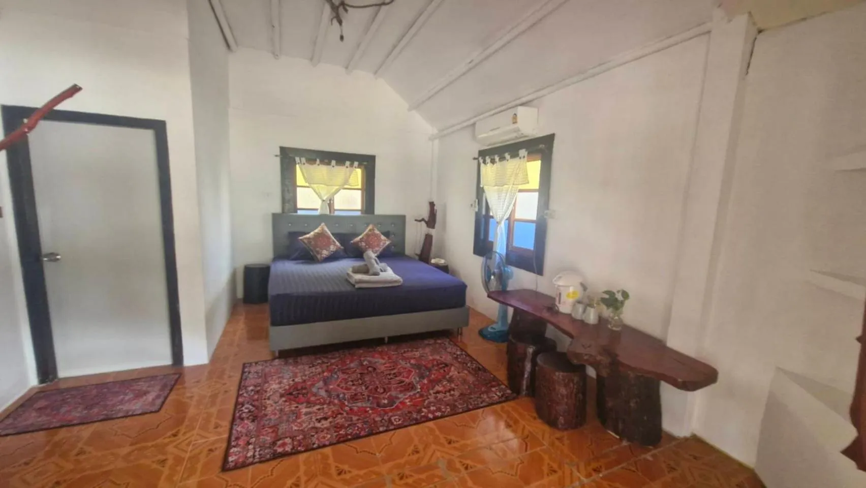 Bed in Mai Pen Rai Bungalows