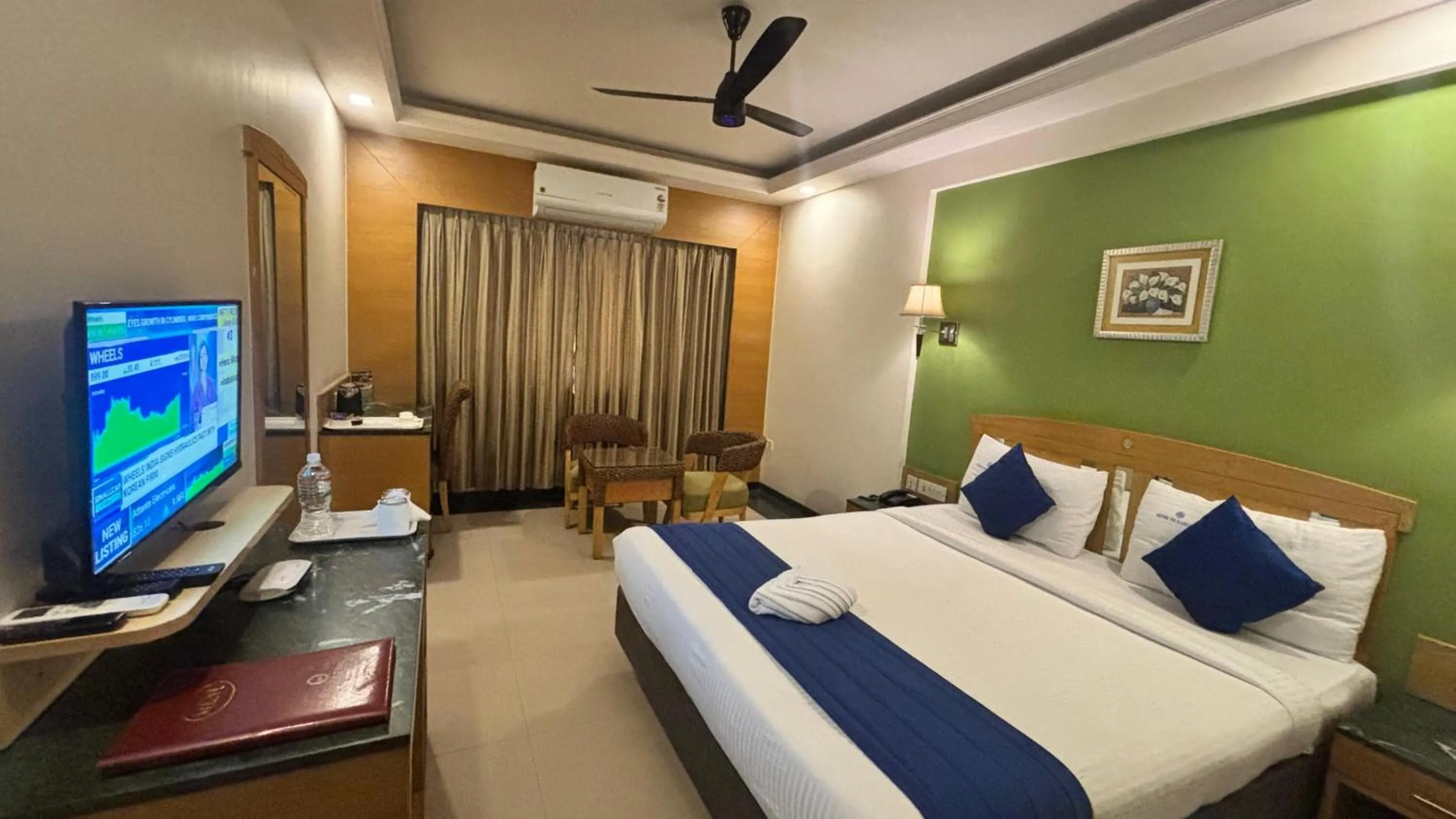 Communal lounge/ TV room, Bed in Hotel Dr Rajkumar International