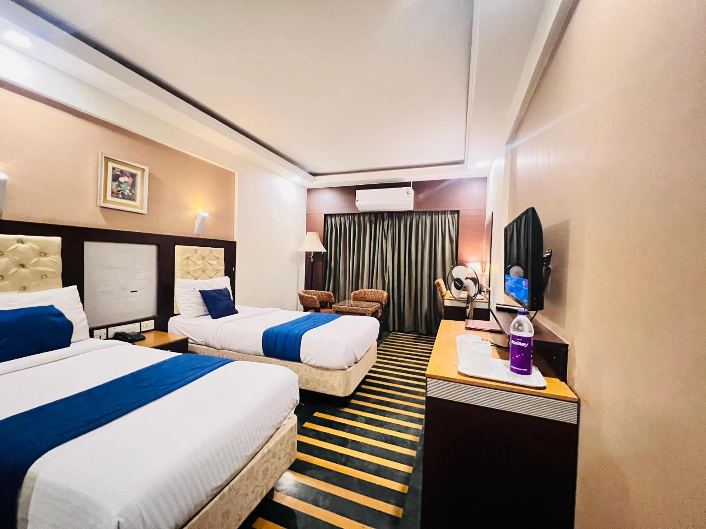 Communal lounge/ TV room, Bed in Hotel Dr Rajkumar International