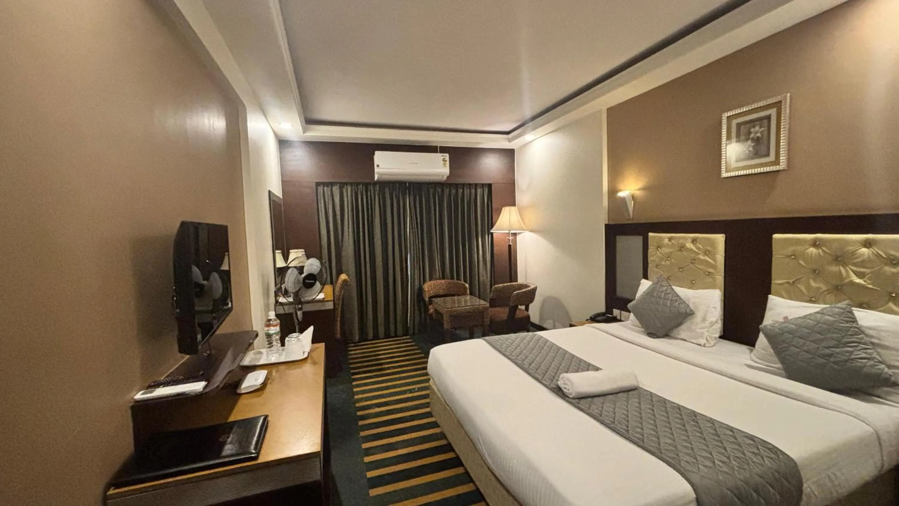 Bed in Hotel Dr Rajkumar International