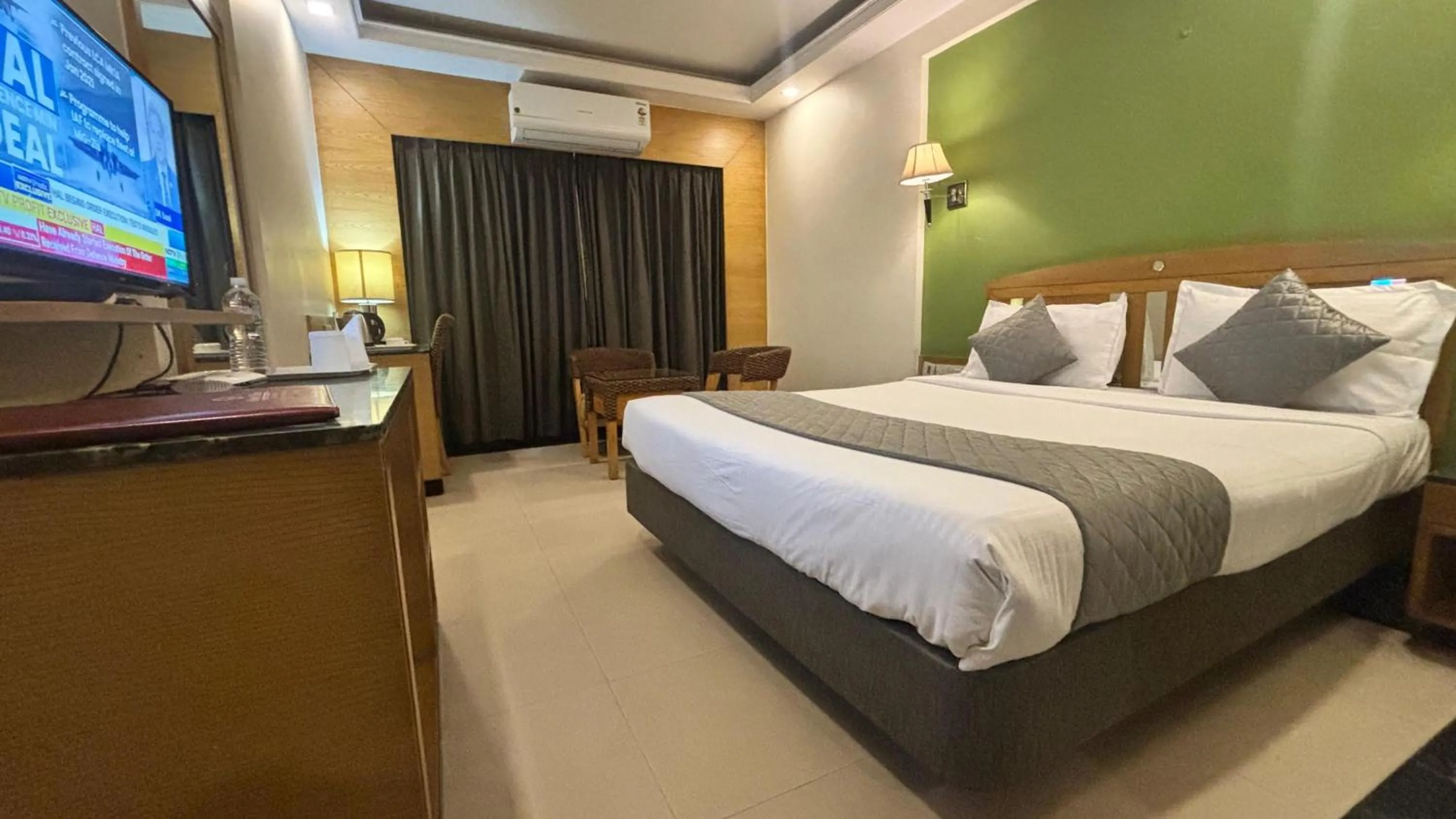 Communal lounge/ TV room, Bed in Hotel Dr Rajkumar International