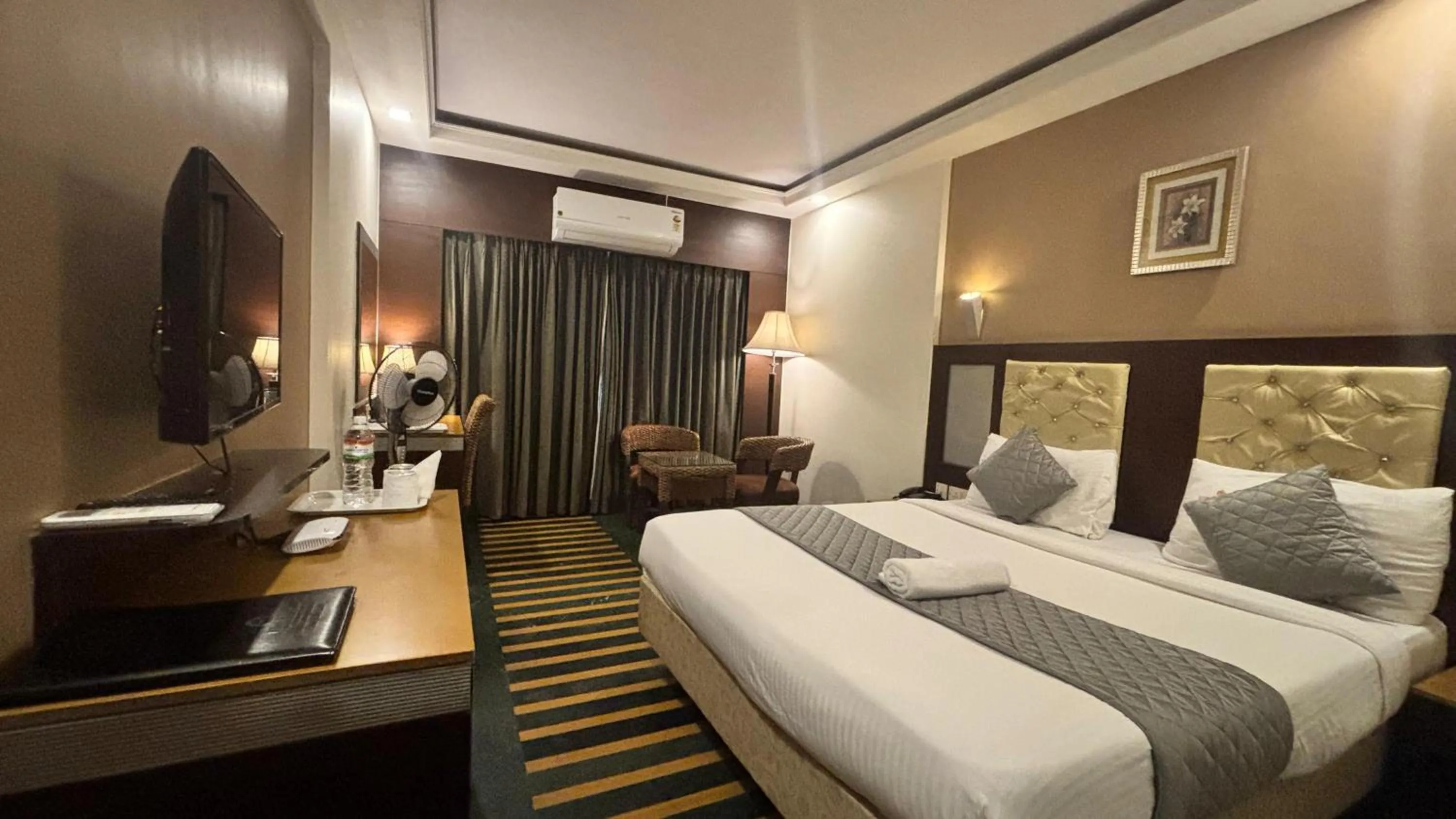 Bed in Hotel Dr Rajkumar International