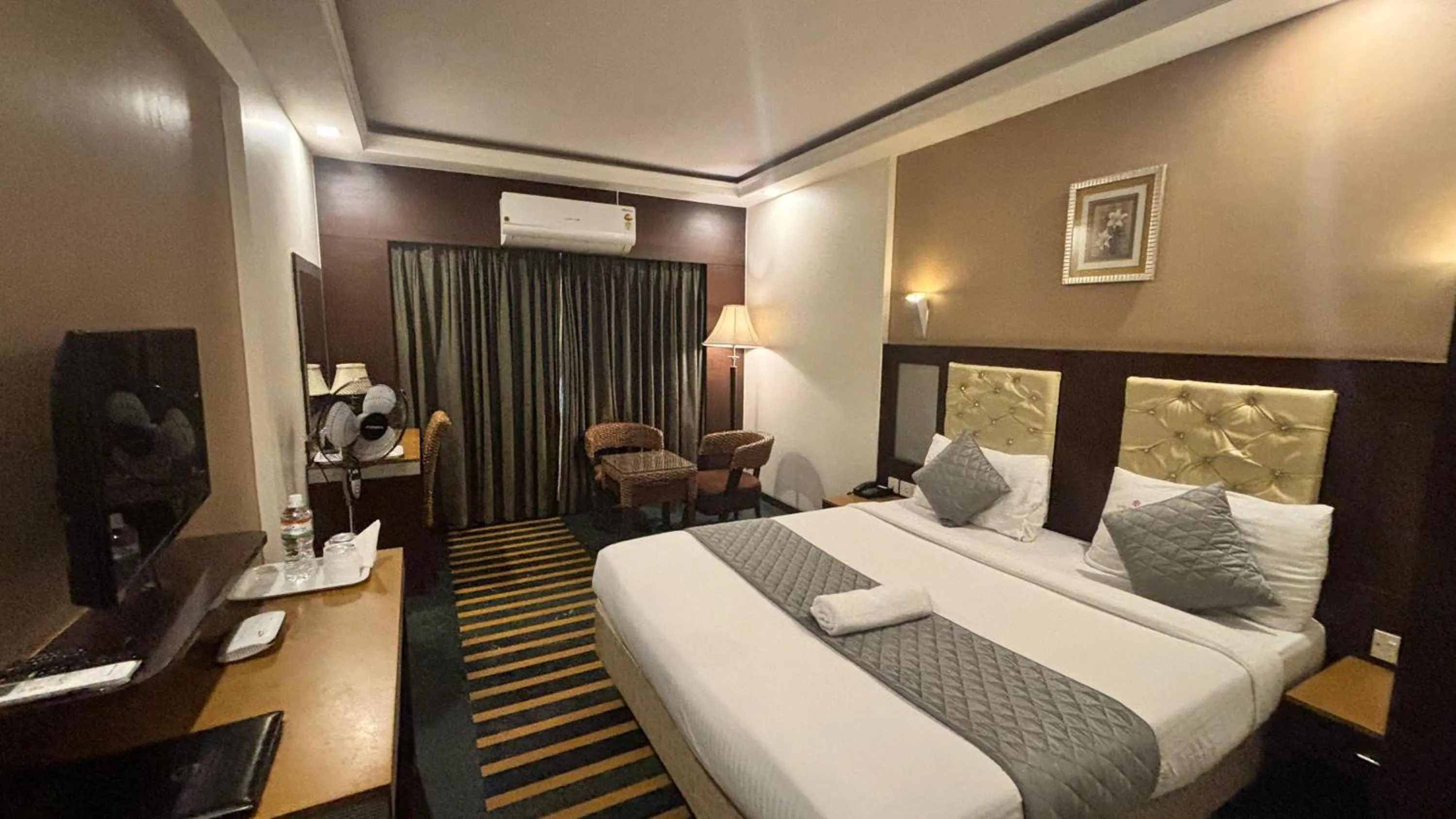 Bed in Hotel Dr Rajkumar International