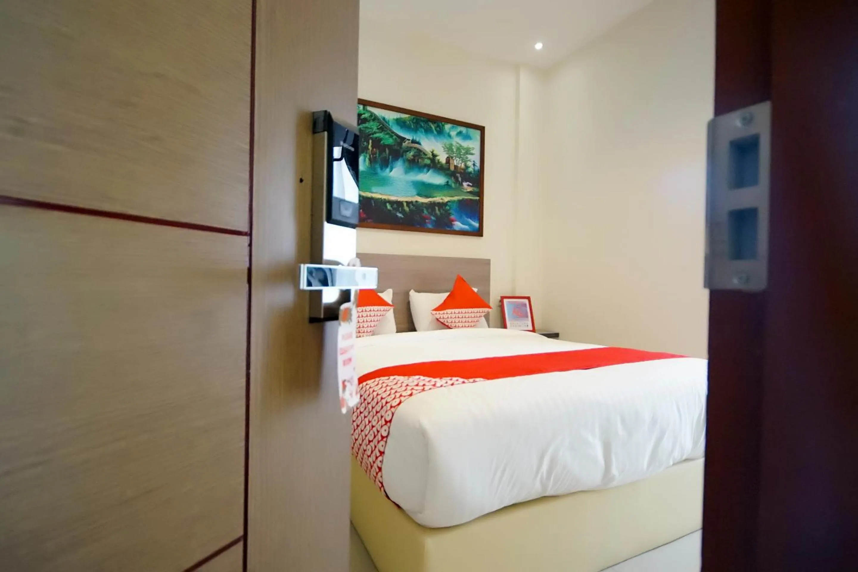 Bedroom in OYO 251 The Maximus Inn Hotel