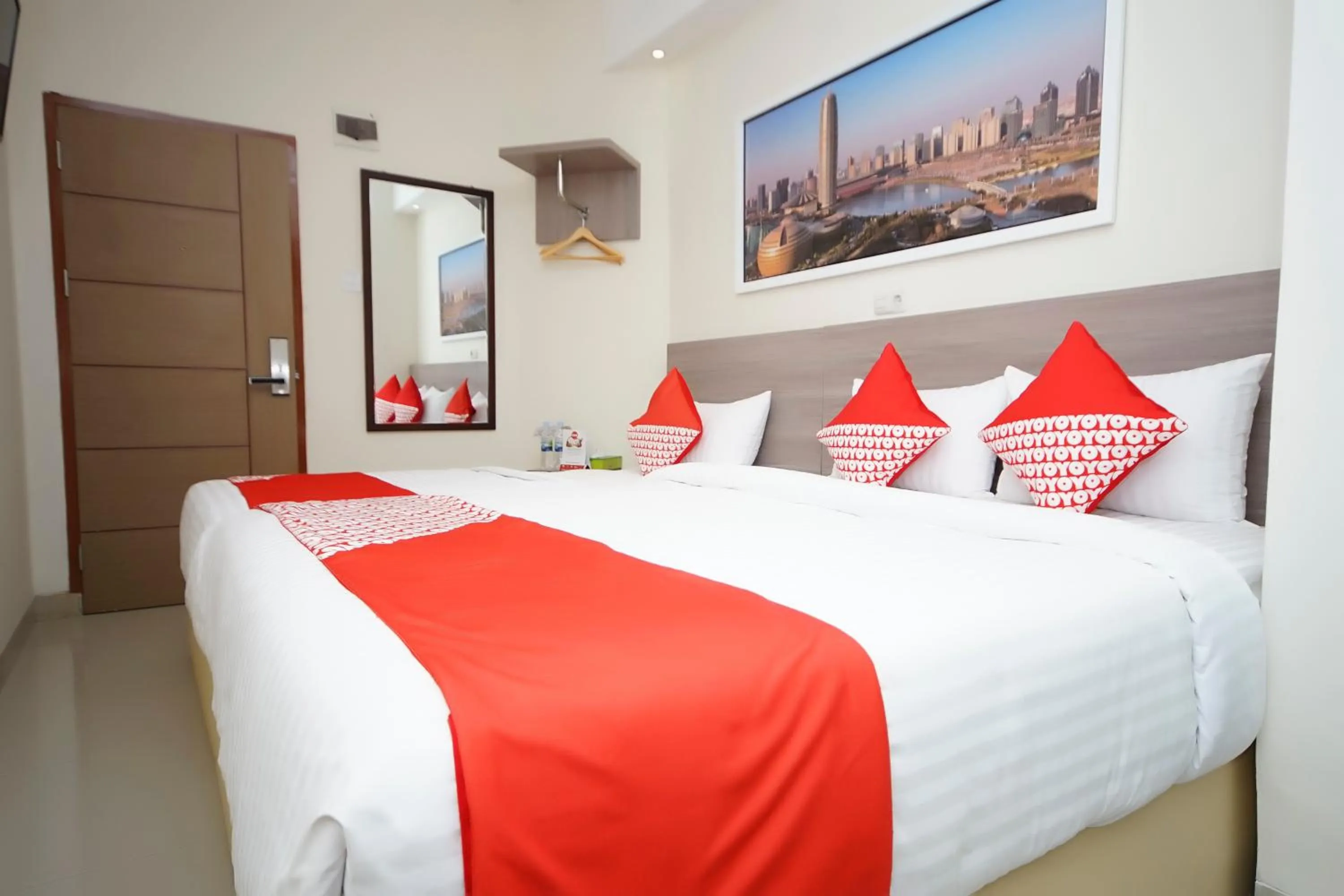 Bedroom in OYO 251 The Maximus Inn Hotel