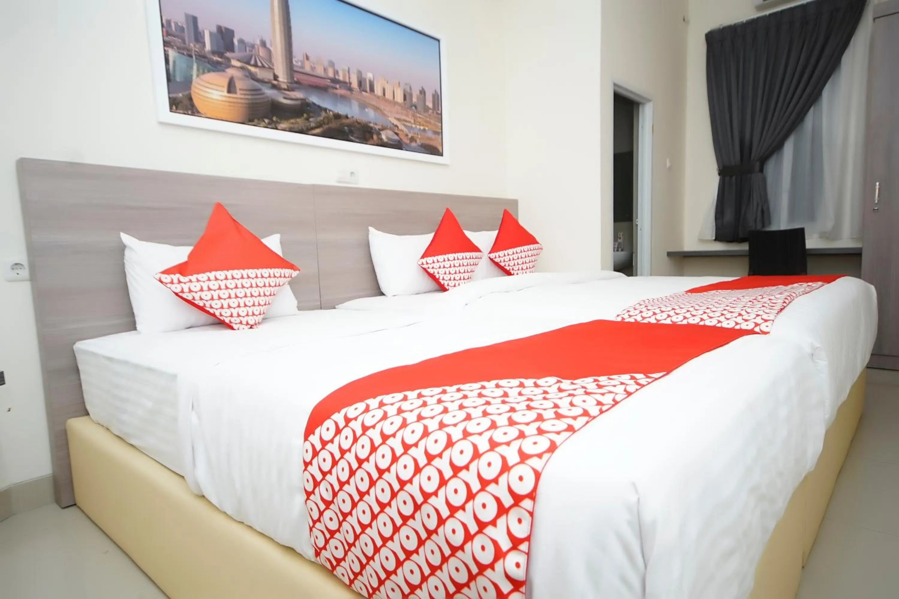 Bedroom in OYO 251 The Maximus Inn Hotel