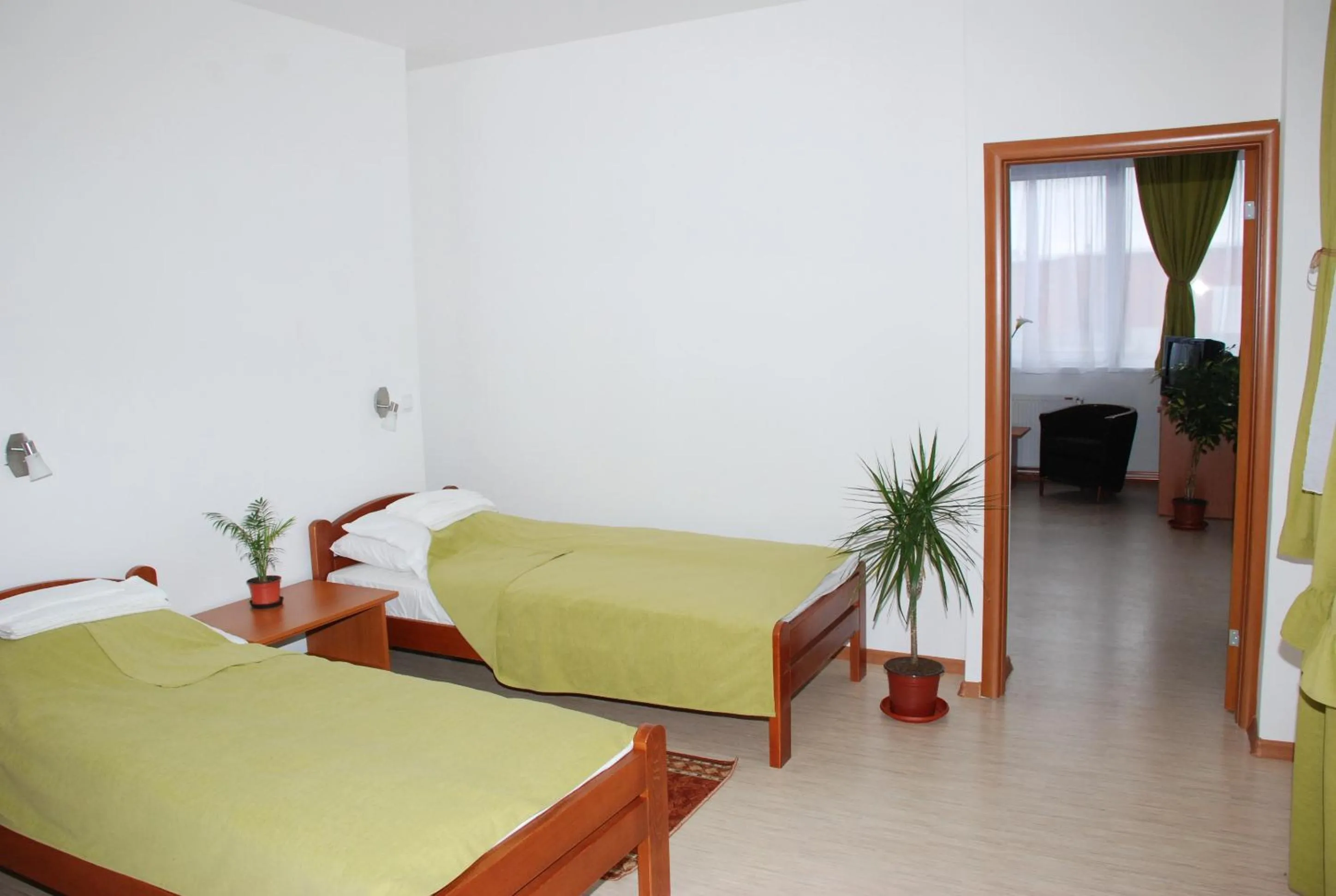 Bed in M Garni Hotel