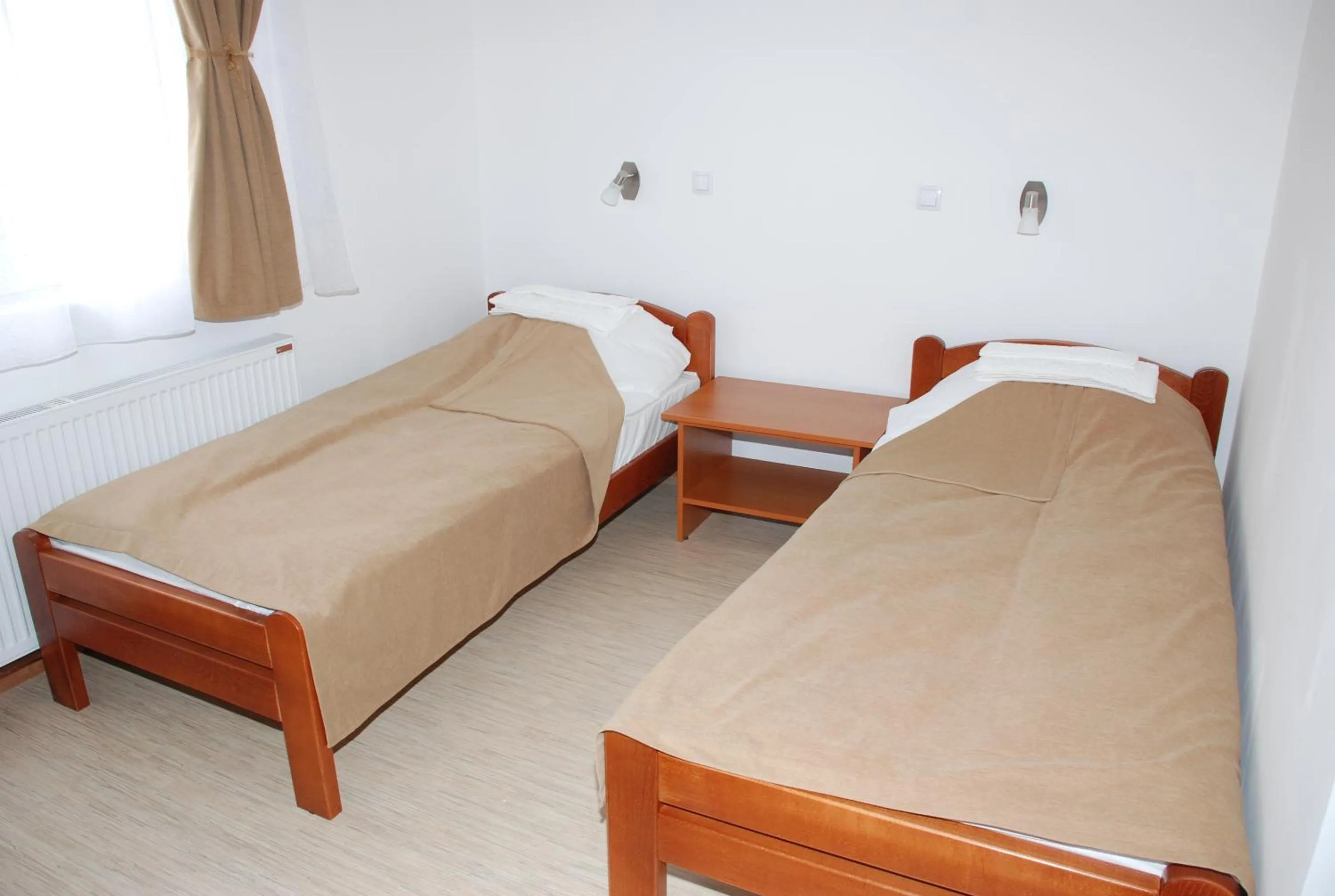 Bed in M Garni Hotel