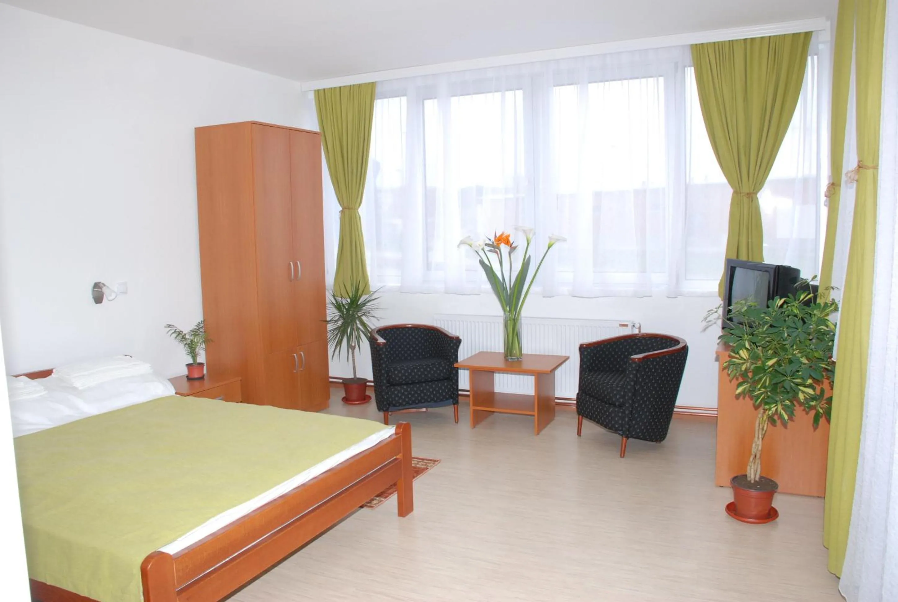 Bed in M Garni Hotel