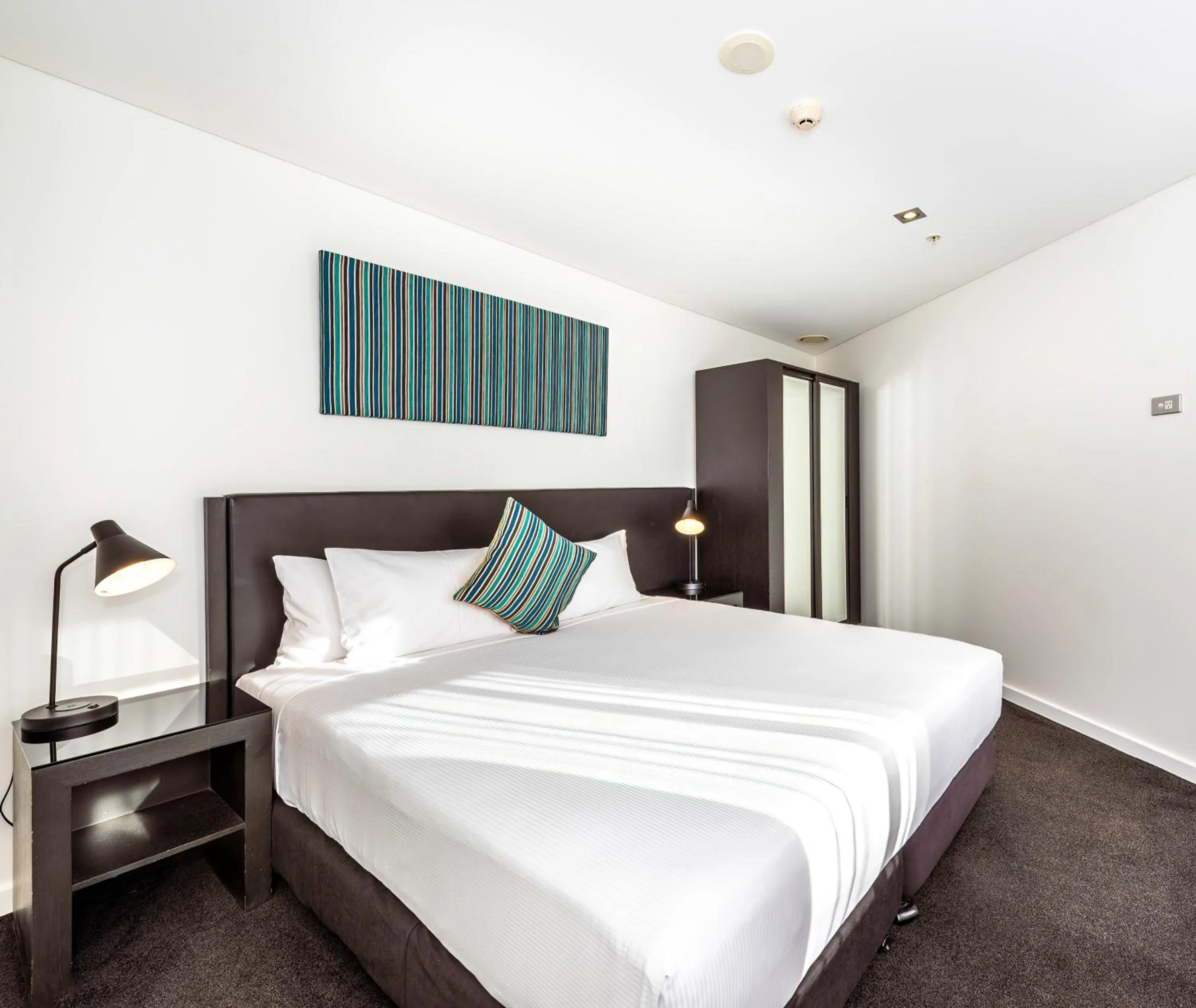 Bed in Oaks Auckland Hotel