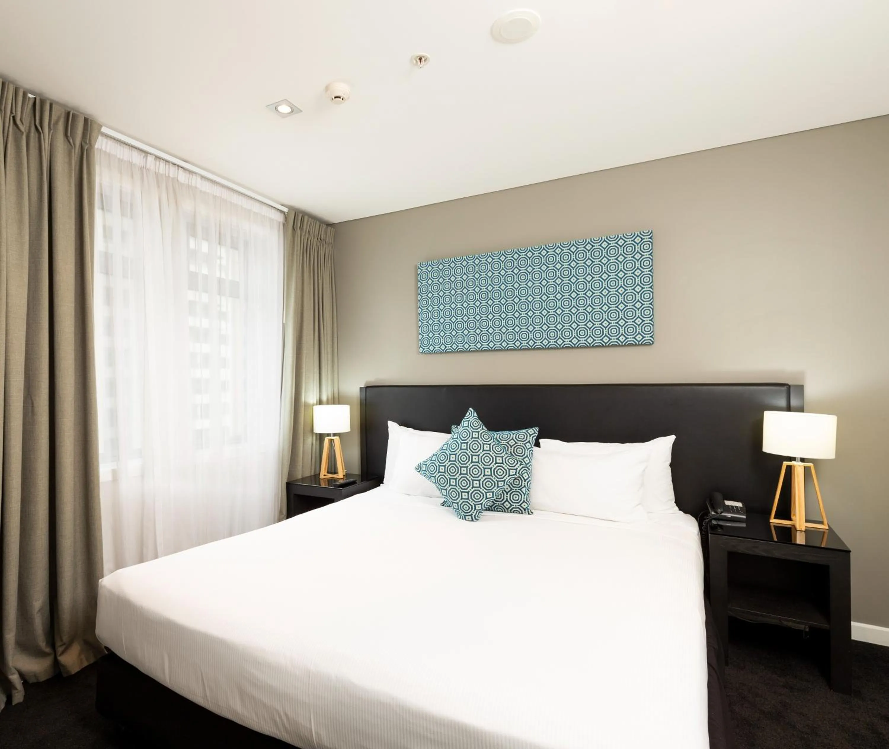 Bed in Oaks Auckland Hotel