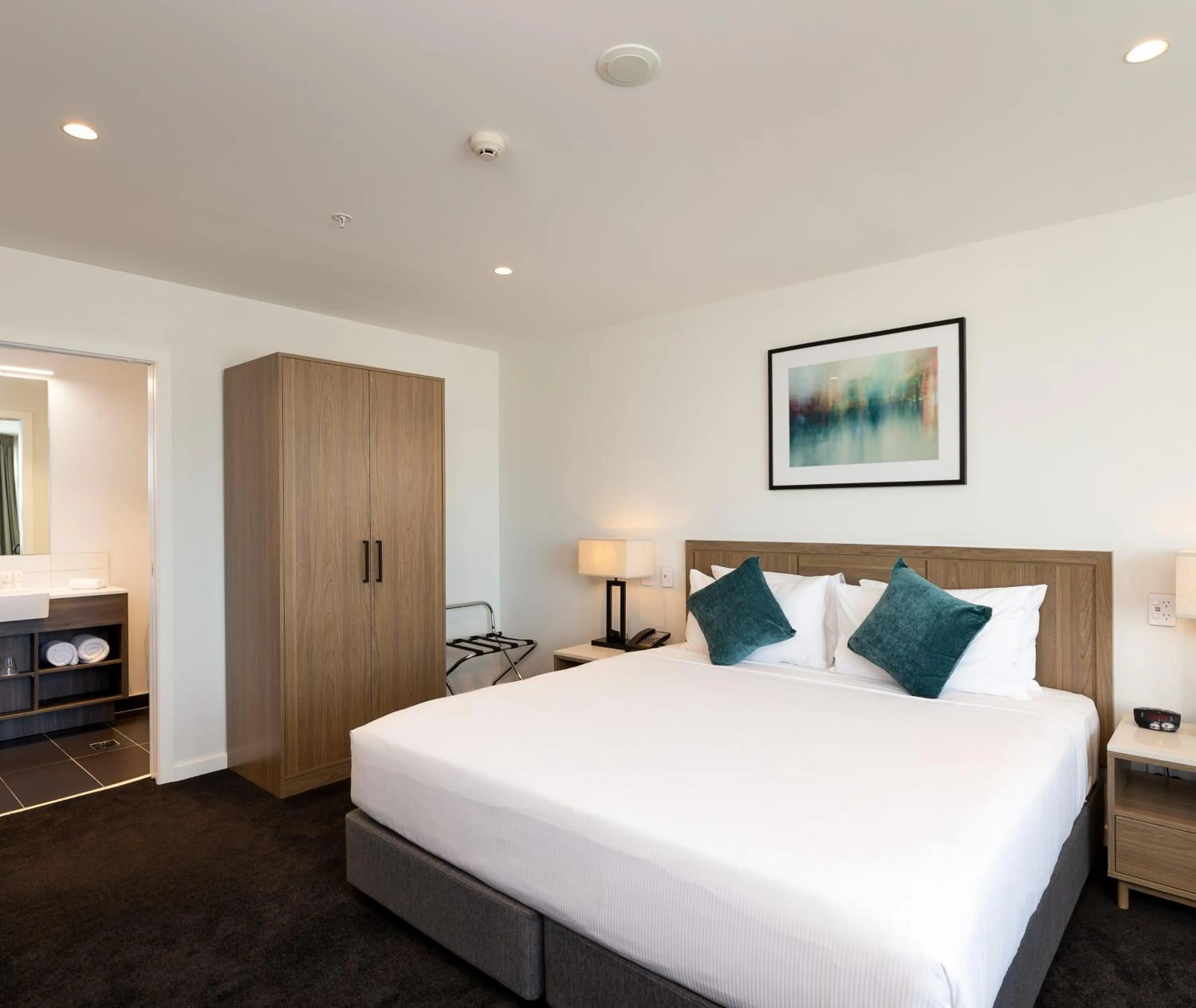 Bed in Oaks Auckland Hotel