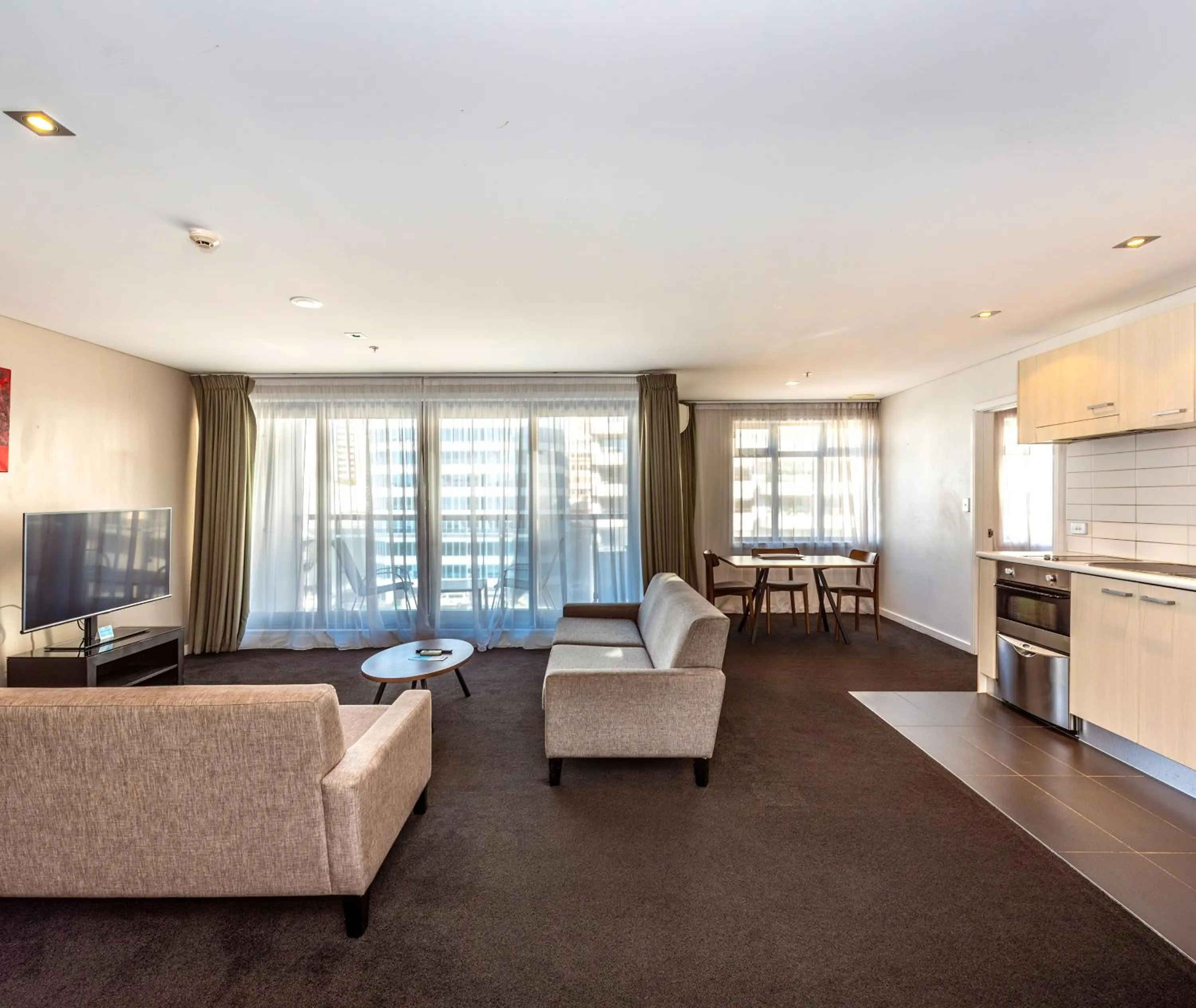 Living room in Oaks Auckland Hotel