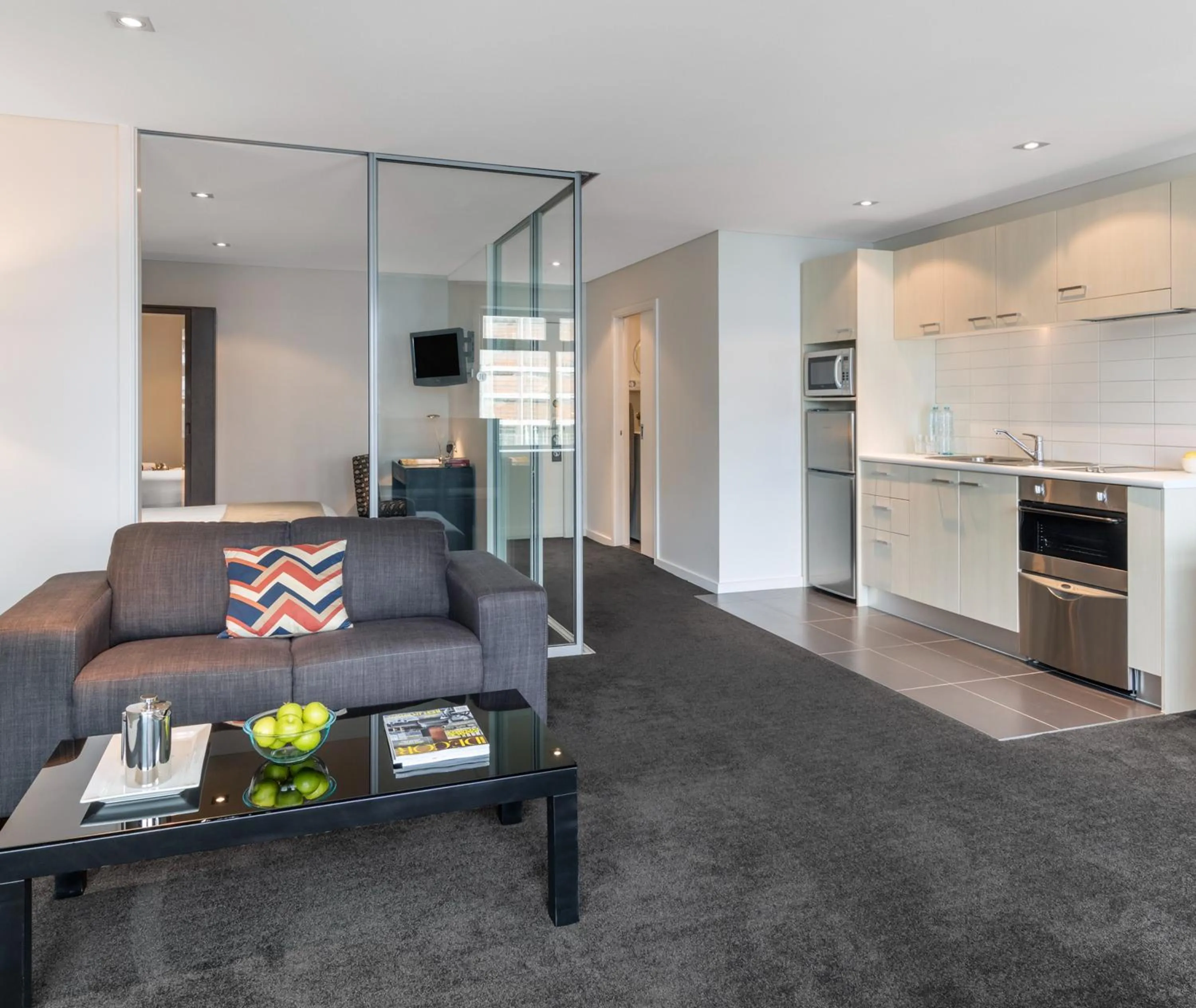 Living room in Oaks Auckland Hotel